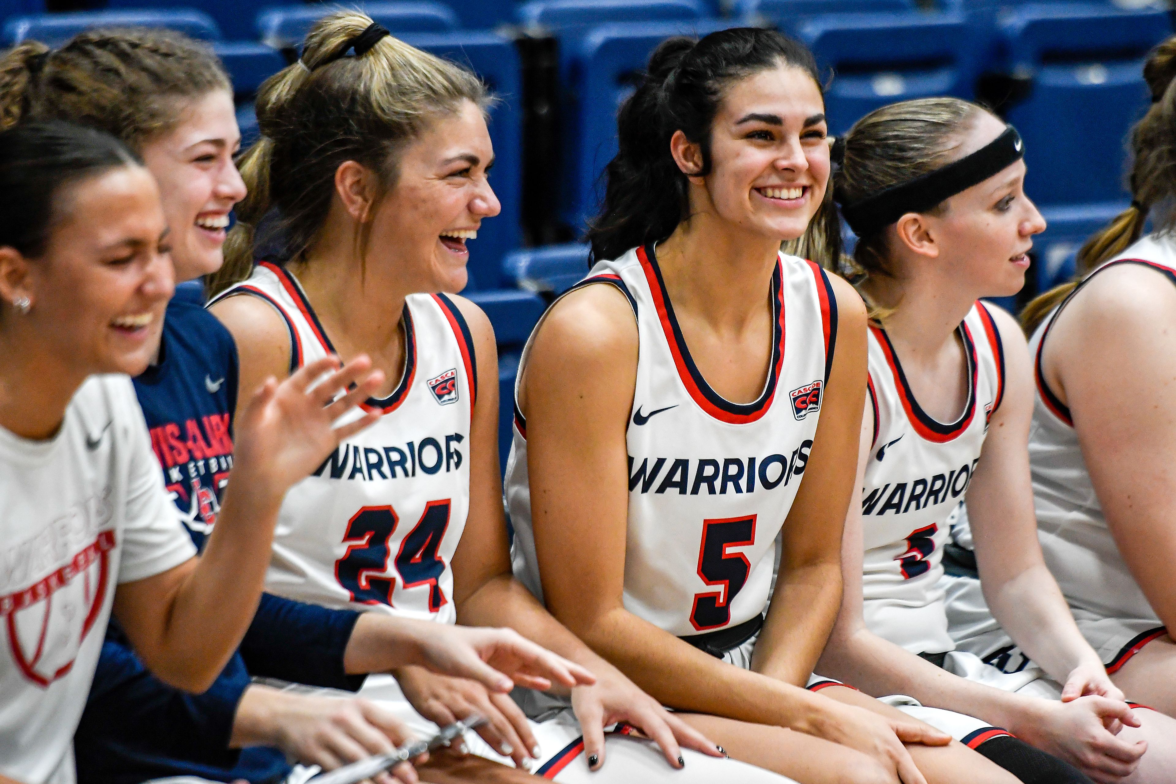 Lewis-Clark State's Sitara Byrd (5) shares a laugh with her teammates during Saturday's Cascade Conference game against Southern Oregon at the P1FCU Activity Center.