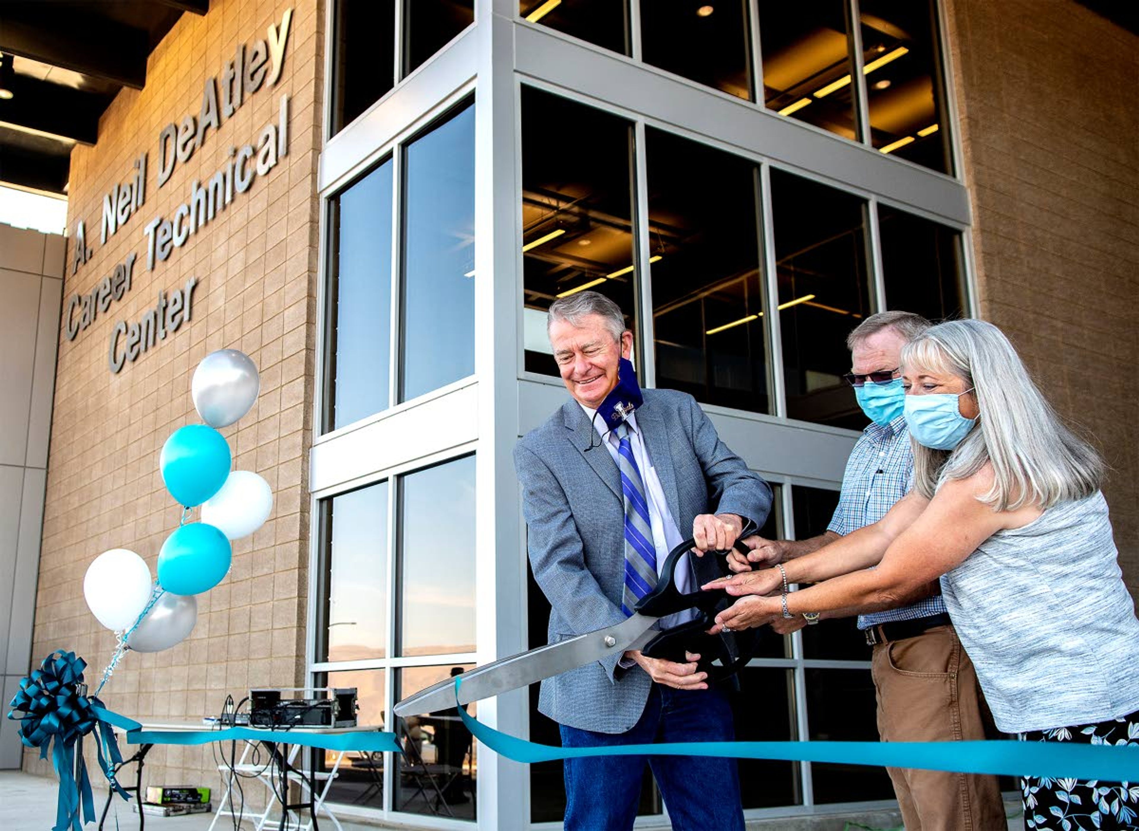 Gov. Brad Little is joined by Brien and Shelly DeAtley for the ribbon-cutting on the A. Neil DeAtley Career Technical Center on Friday.