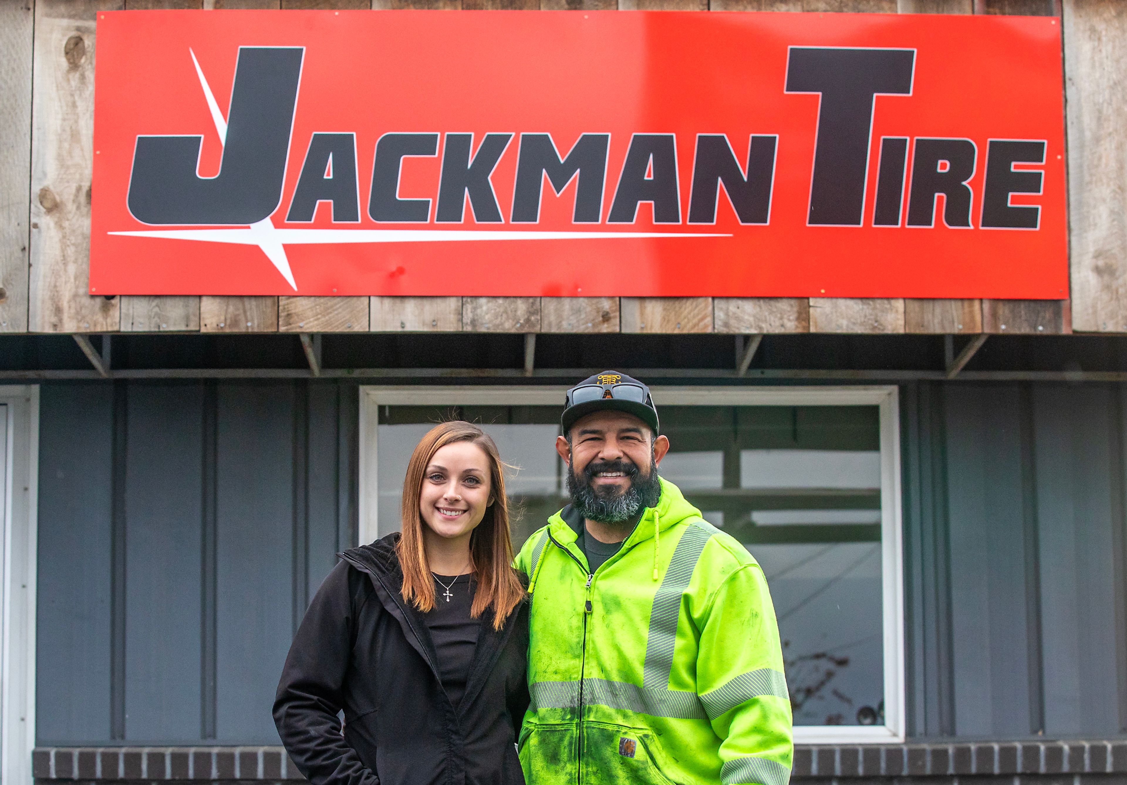 Meghan Garrett and Martin Flores pose for a photo outside Jackman Tire Thursday in the Lewiston Orchards.