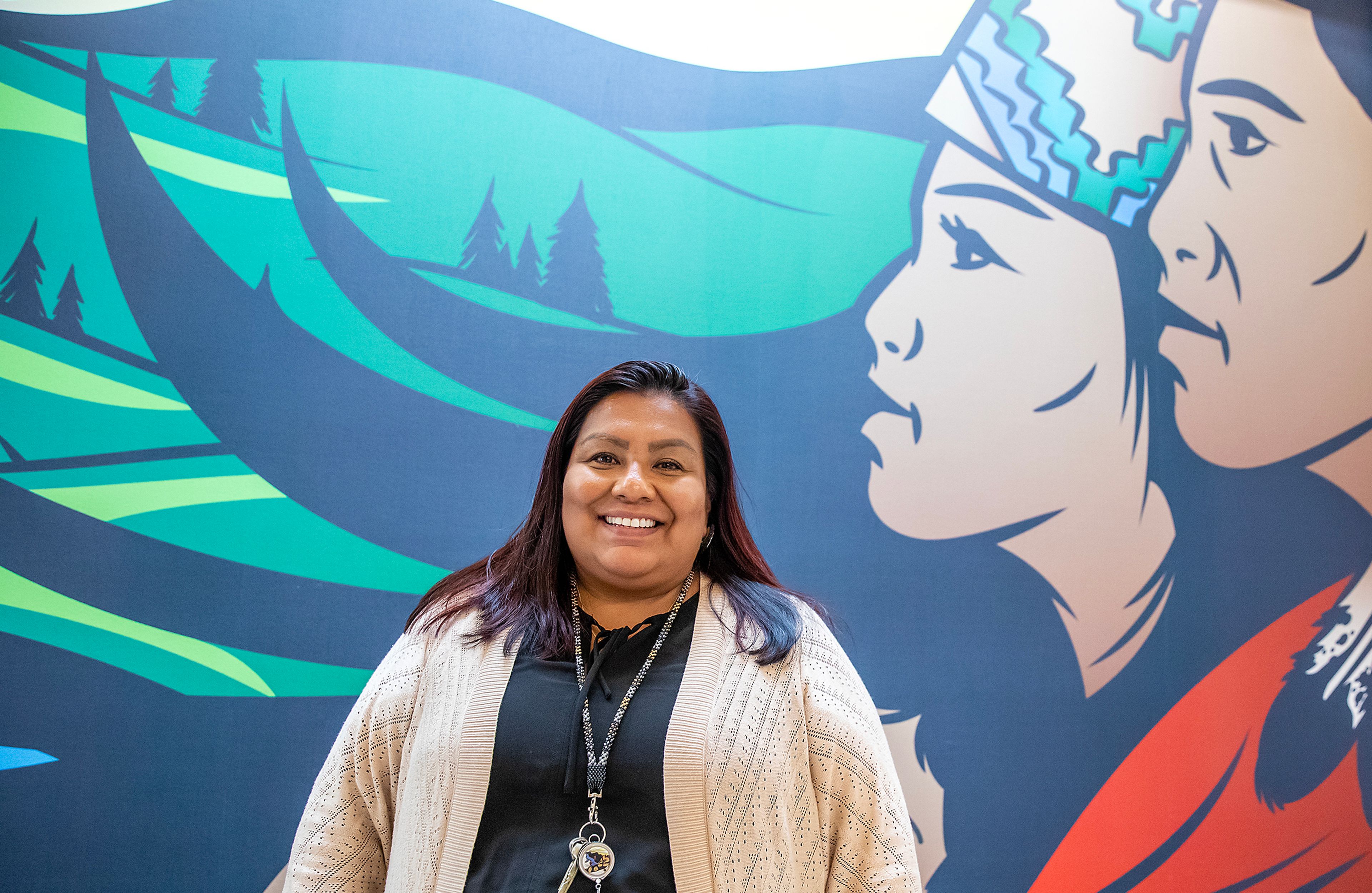 Roberta Jose-Bisbee stands for a portrait in front of the mural at Nimiipuu Health Tuesday in Lapwai.