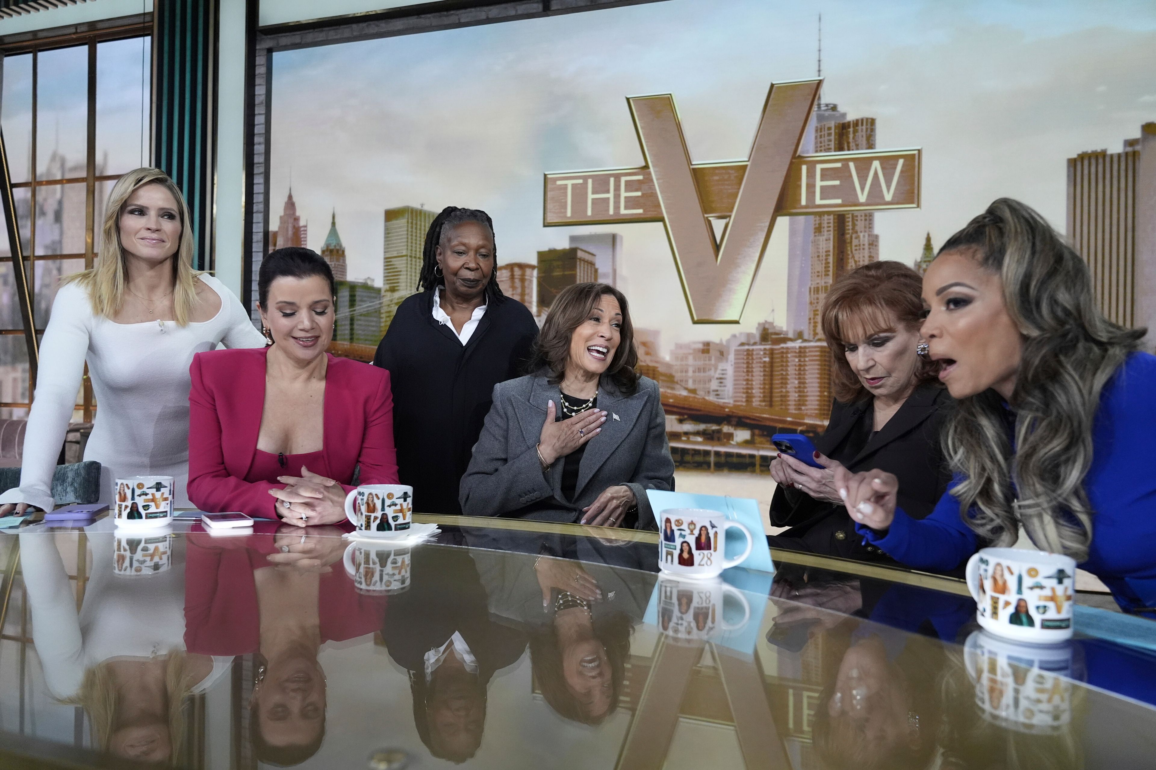 Democratic presidential nominee Vice President Kamala Harris chats with the hosts during a commercial break at The View, Tuesday, Oct. 8, 2024, in New York. From left are Sara Haines, Ana Navarro, Whoopi Goldberg, Harris, Joy Behar and Sunny Hostin. (AP Photo/Jacquelyn Martin)