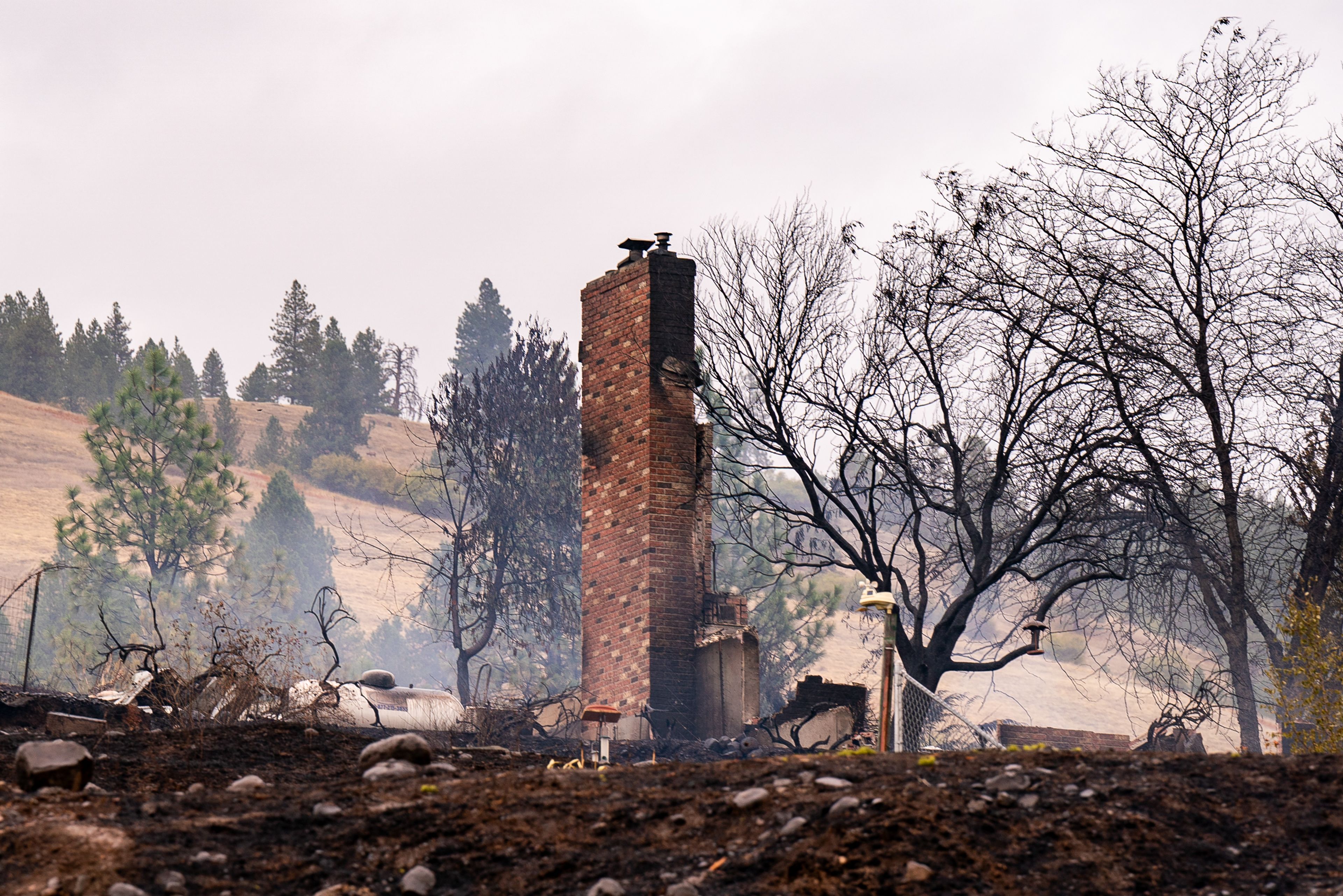 A lone chimney remains from a home on Wixson Heights Road in Orofino on Wednesday following the hospital fire that damaged six homes the previous night.