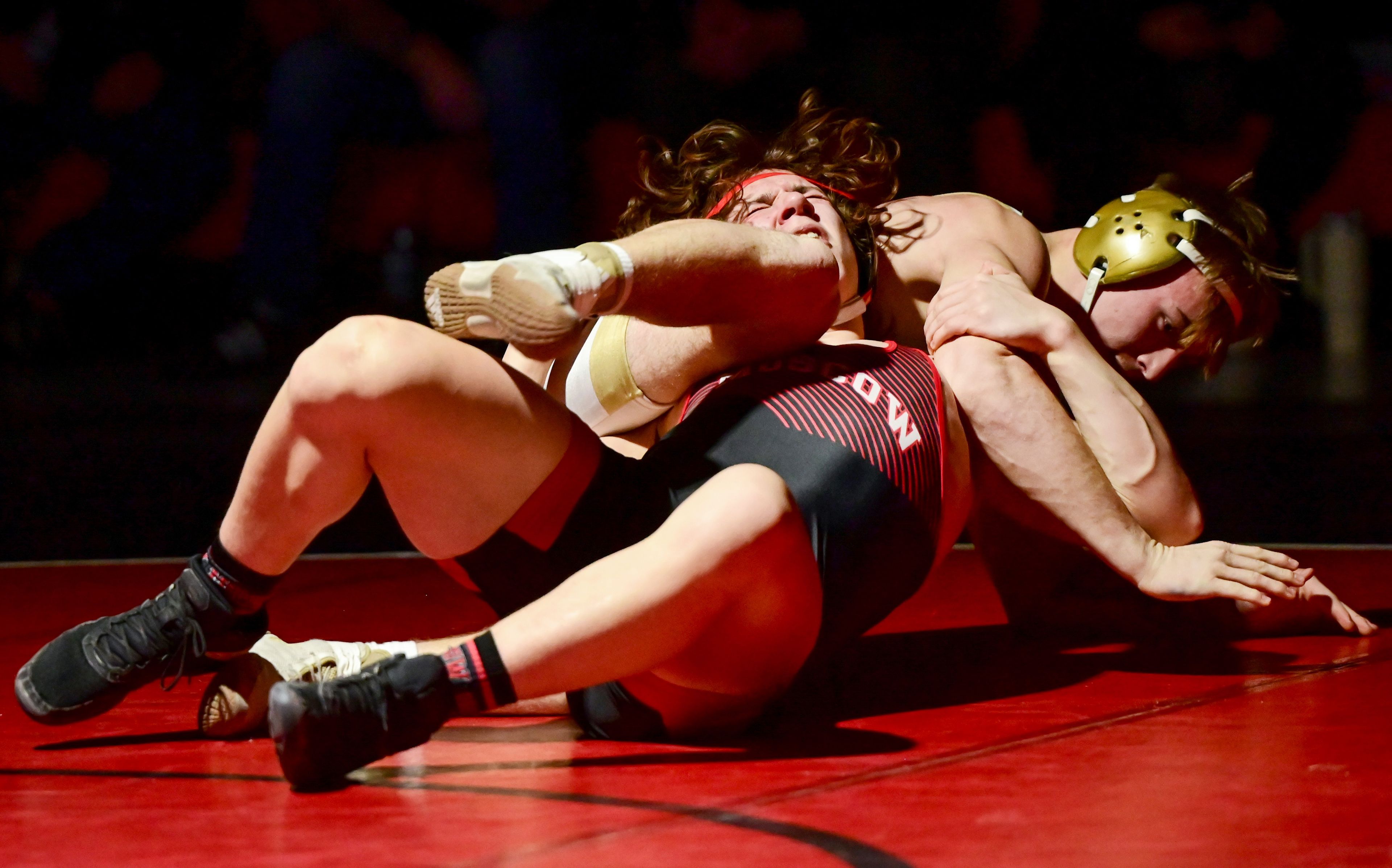 Moscow’s Lucas Deaton is pulled backward by St. Maries’ Trey Gibson during a match Thursday at Bear Den in Moscow.