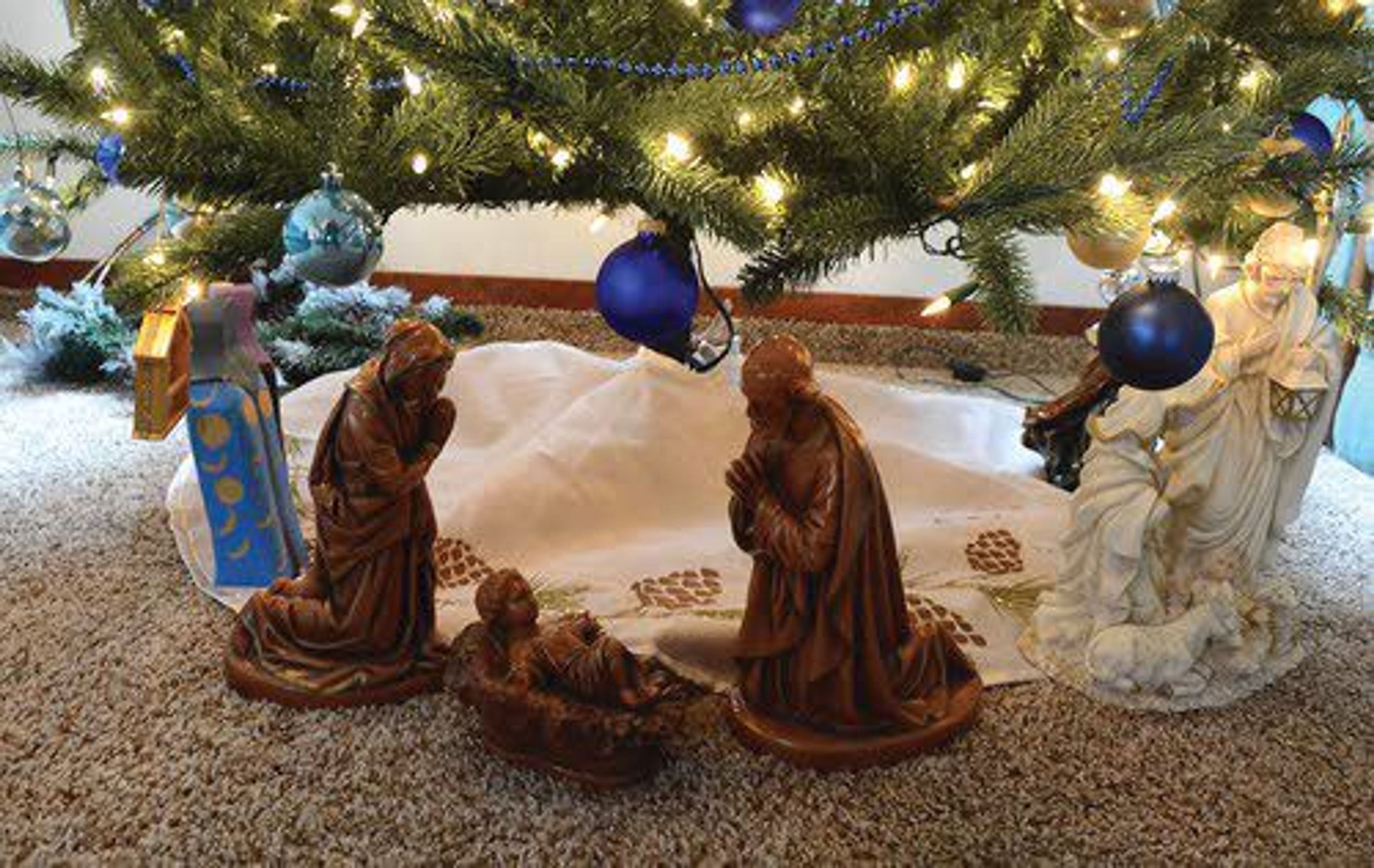 ABOVE: It started with this Nativity scene. Now more than 200 additional scenes have joined Ohrtman’s growing collection.LEFT: Ohrtman says his favorite Nativity scene is this set made in Peru.