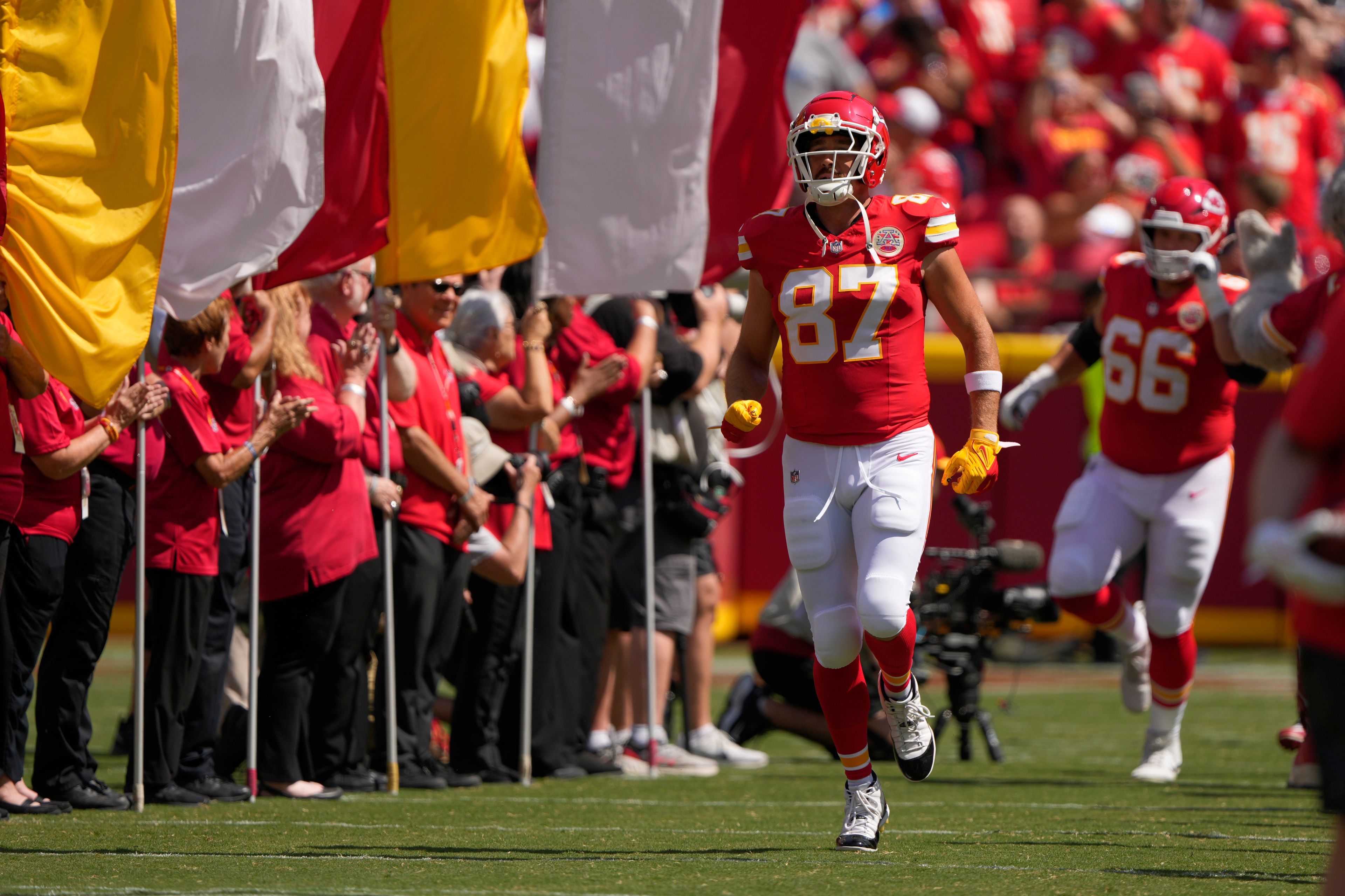 Kansas City Chiefs tight end Travis Kelce (87) runs onto the field before an NFL preseason game against the Detroit Lions Saturday, Aug. 17, 2024, in Kansas City, Mo.