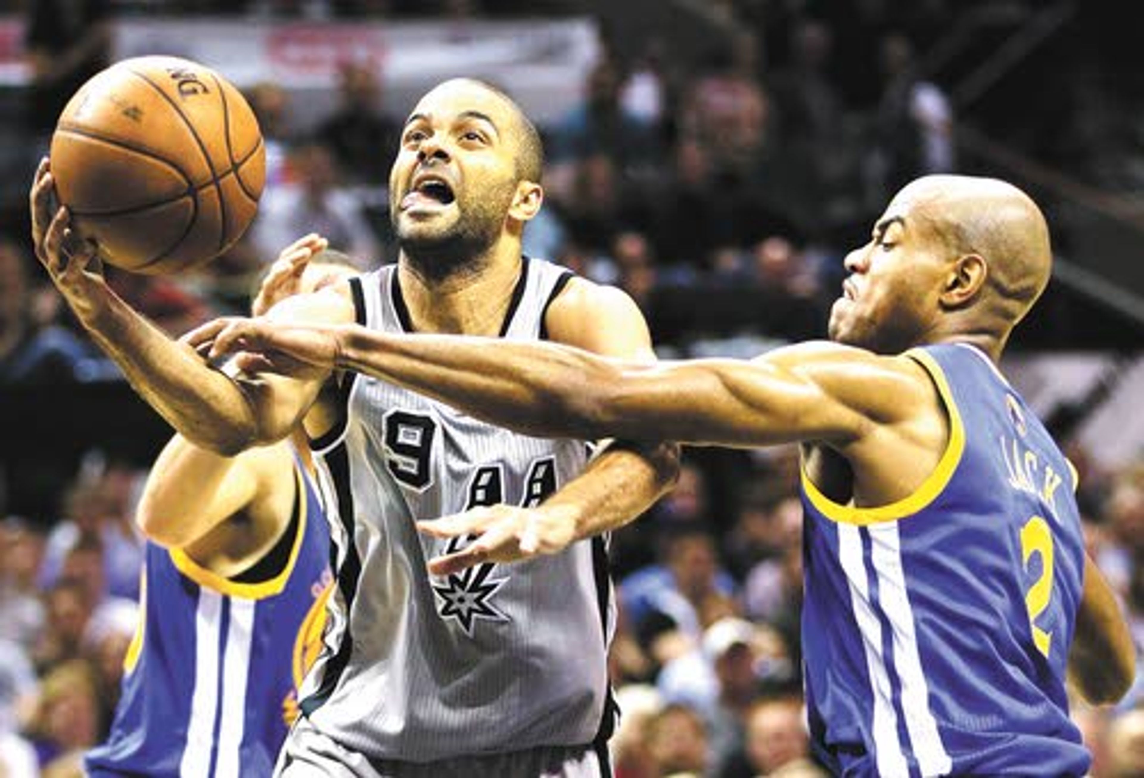 San Antonio’s Tony Parker gets hacked by Golden State’s Jarrett Jack (right). Parker tallied 25 points and 10 assists to lead the Spurs to a 109-91 win over the Warriors on Tuesday.