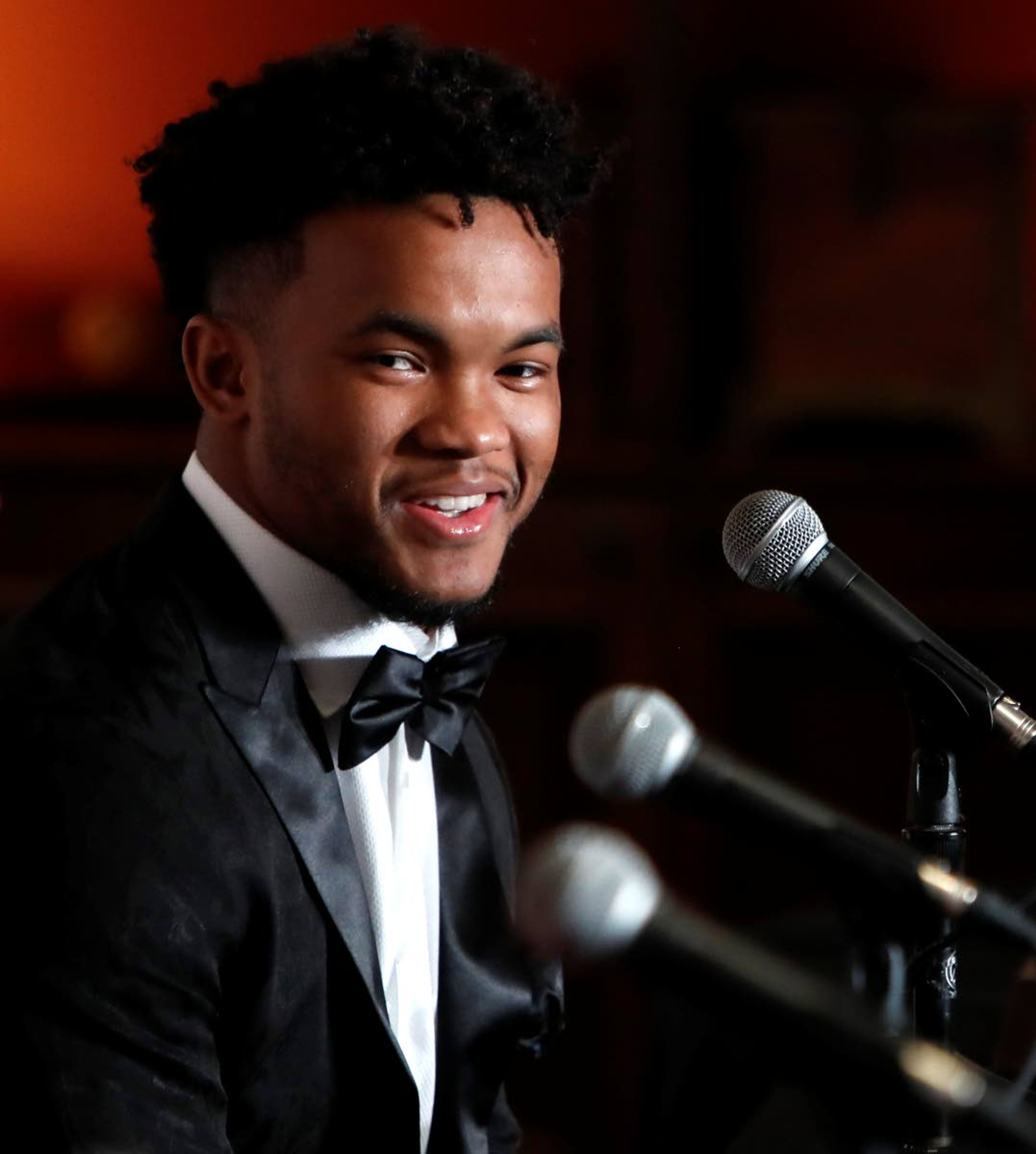 Heisman Trophy winner quarterback Kyler Murray smiles during the Davey O'Brien Award news conference in Fort Worth, Texas, Monday, Feb. 18, 2019. Murray accepted the award in his first public appearance since he announced his plan to pursue an NFL football career rather than report to spring training as a first-round pick of the Oakland A's. (AP Photo/LM Otero)