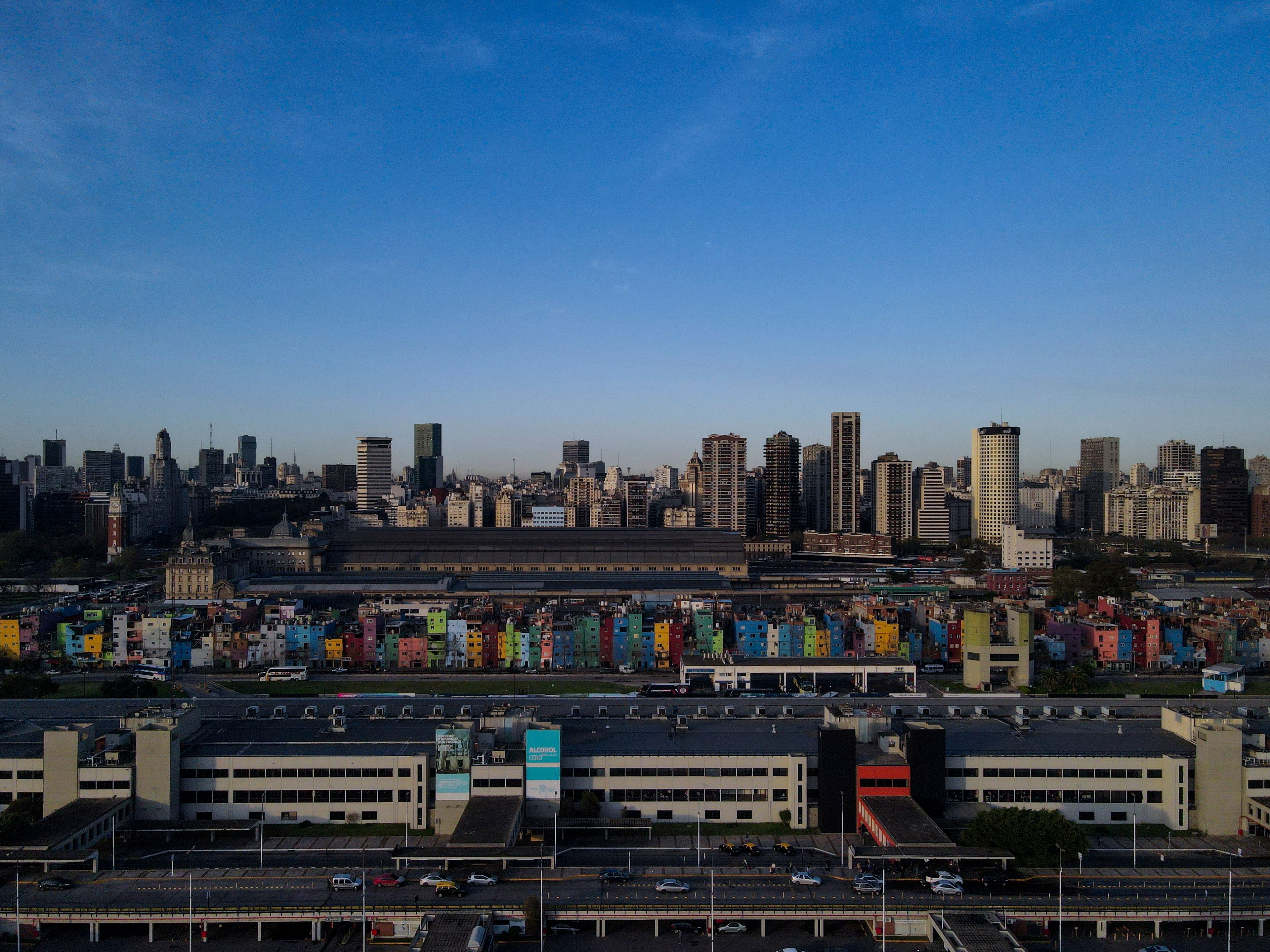 Residential buildings are covered in color in Barrio 31, a working poor neighborhood in downtown Buenos Aires, Argentina, Friday, Sept. 20, 2024. (AP Photo/Natacha Pisarenko)