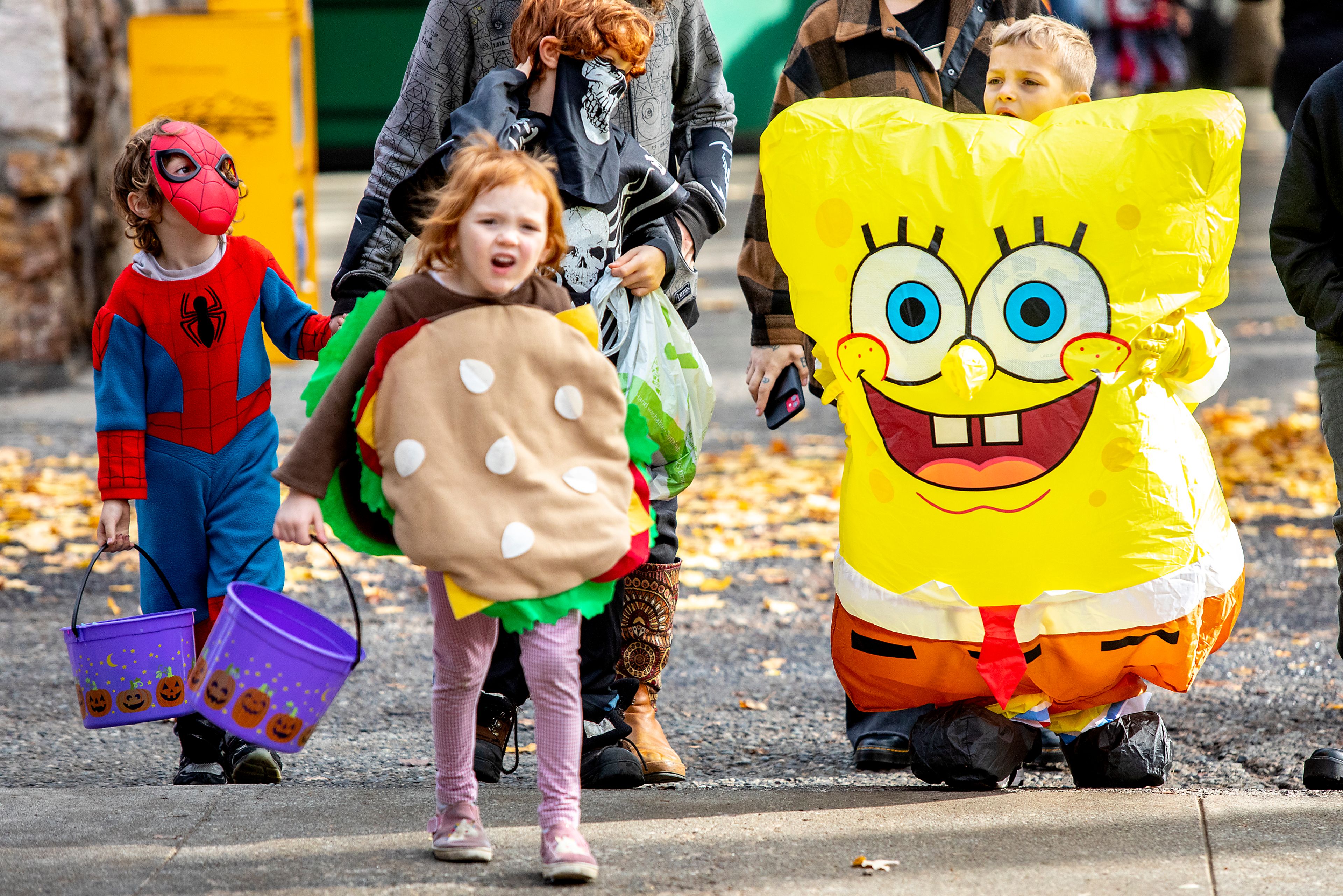 William Quintana, 7, walks down the street dressed as Spongebob with his cousin Alice McCurdy, 4, taking on the role of the krabby patty during Pumpkin Palooza in downtown Lewiston in 2021. The 2024 version of Pumpkin Palooza is planned for noon to 4 p.m. Saturday at downtown Lewiston.