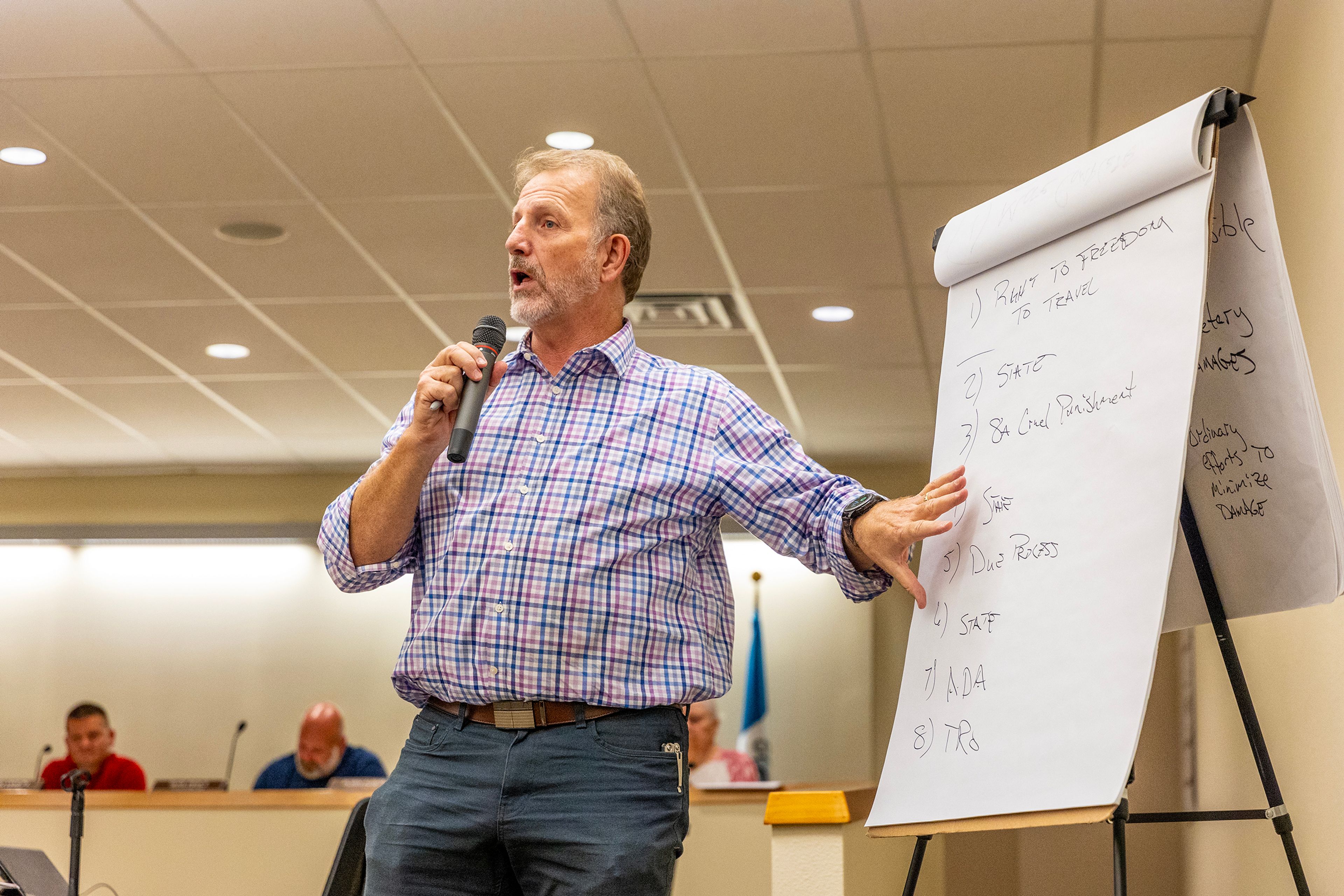 Interim City Attorney Todd Richardson gives a presentation about the lawsuit the City of Clarkston and other cities are facing during a city council meeting Monday in Clarkston.