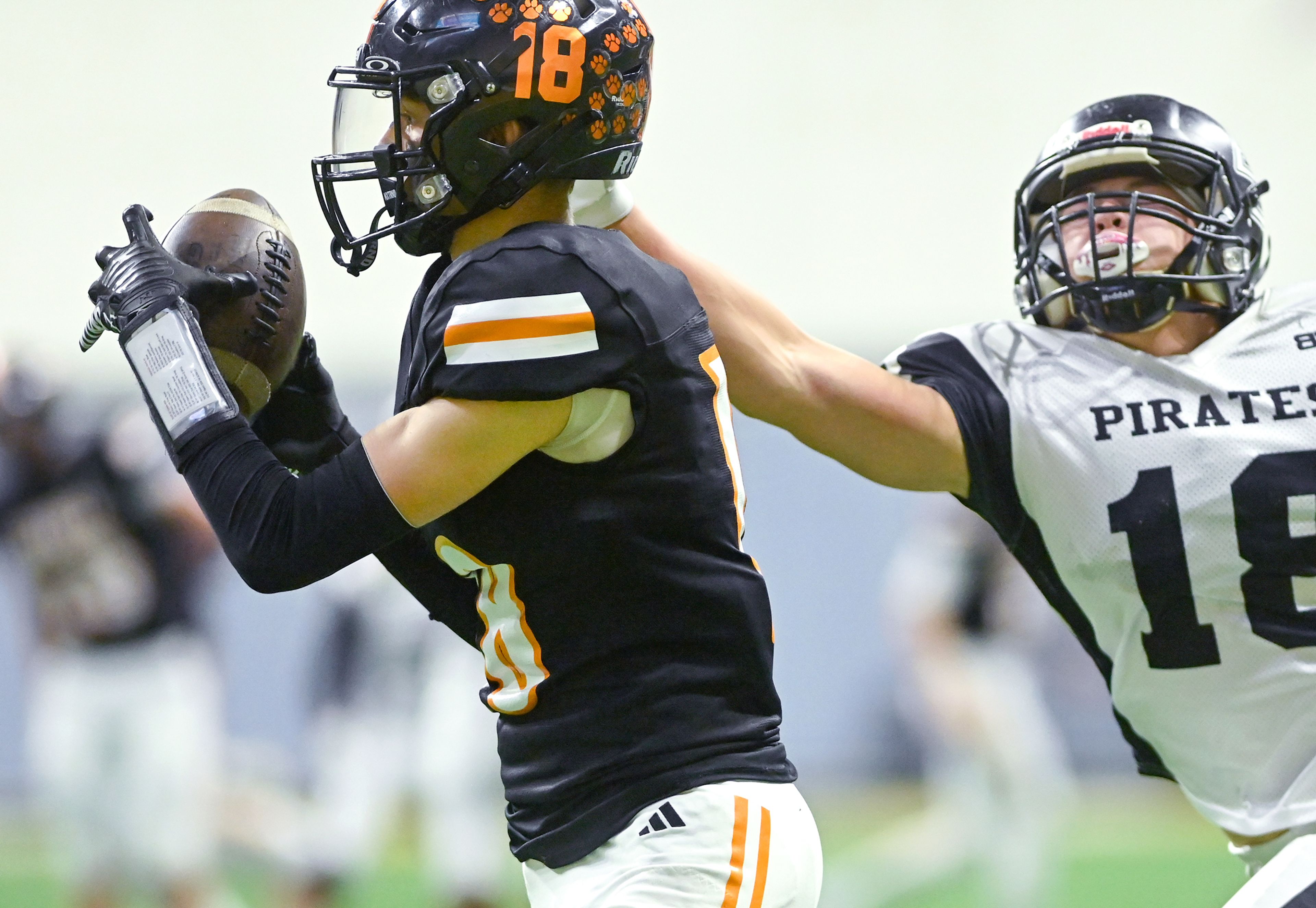 Kendrick’s Cade Silflow completes a pass with pressure from Butte County’s Levi Hendriks Friday during the Idaho 2A football state championship game at the P1FCU Kibbie Dome in Moscow.