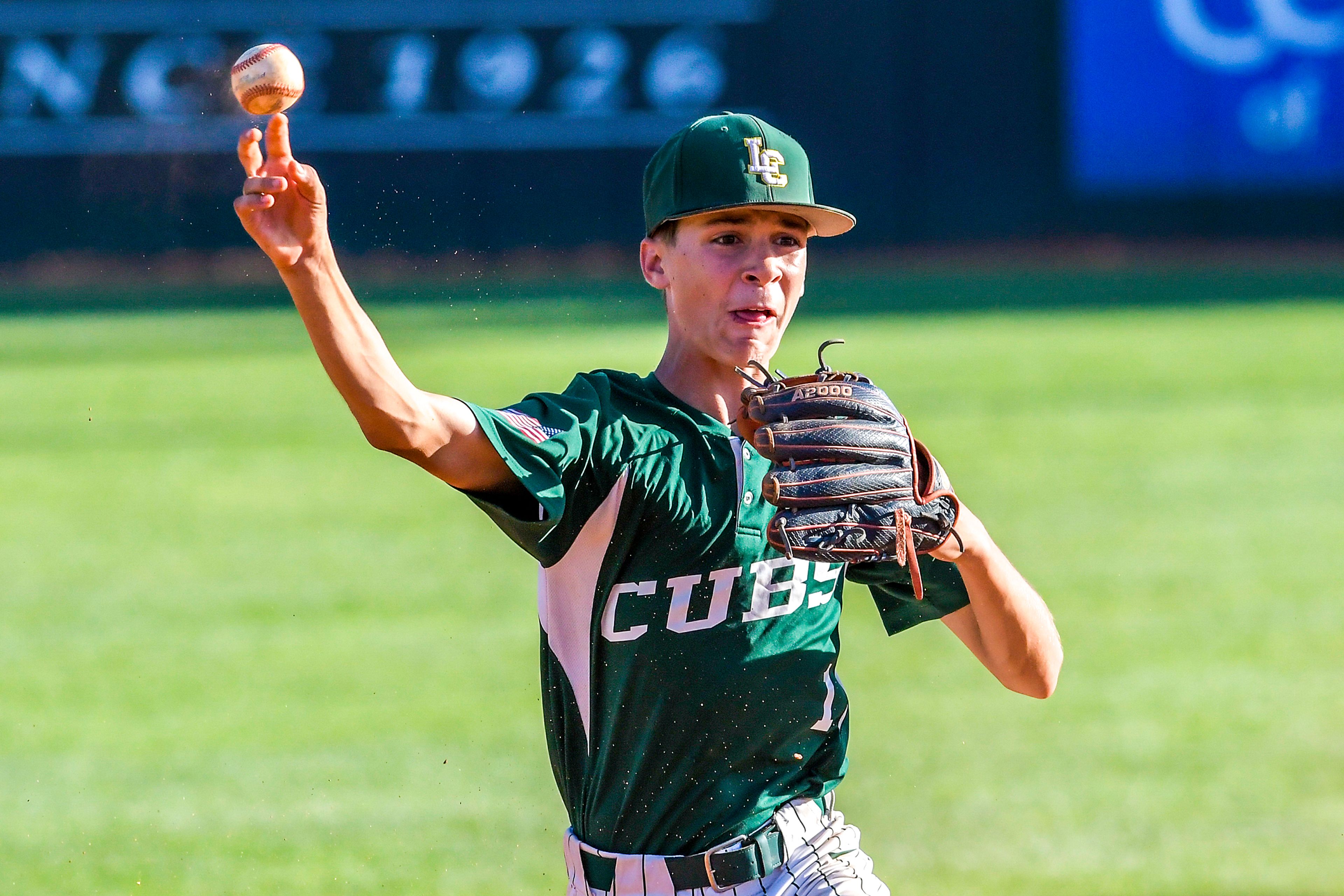 Lewis-Clark Cubs second baseman Zavier McFee throws to first to get the out against the Blue Devils in a game of the Clancy Ellis Tournament on Saturday at Harris Field in Lewiston.