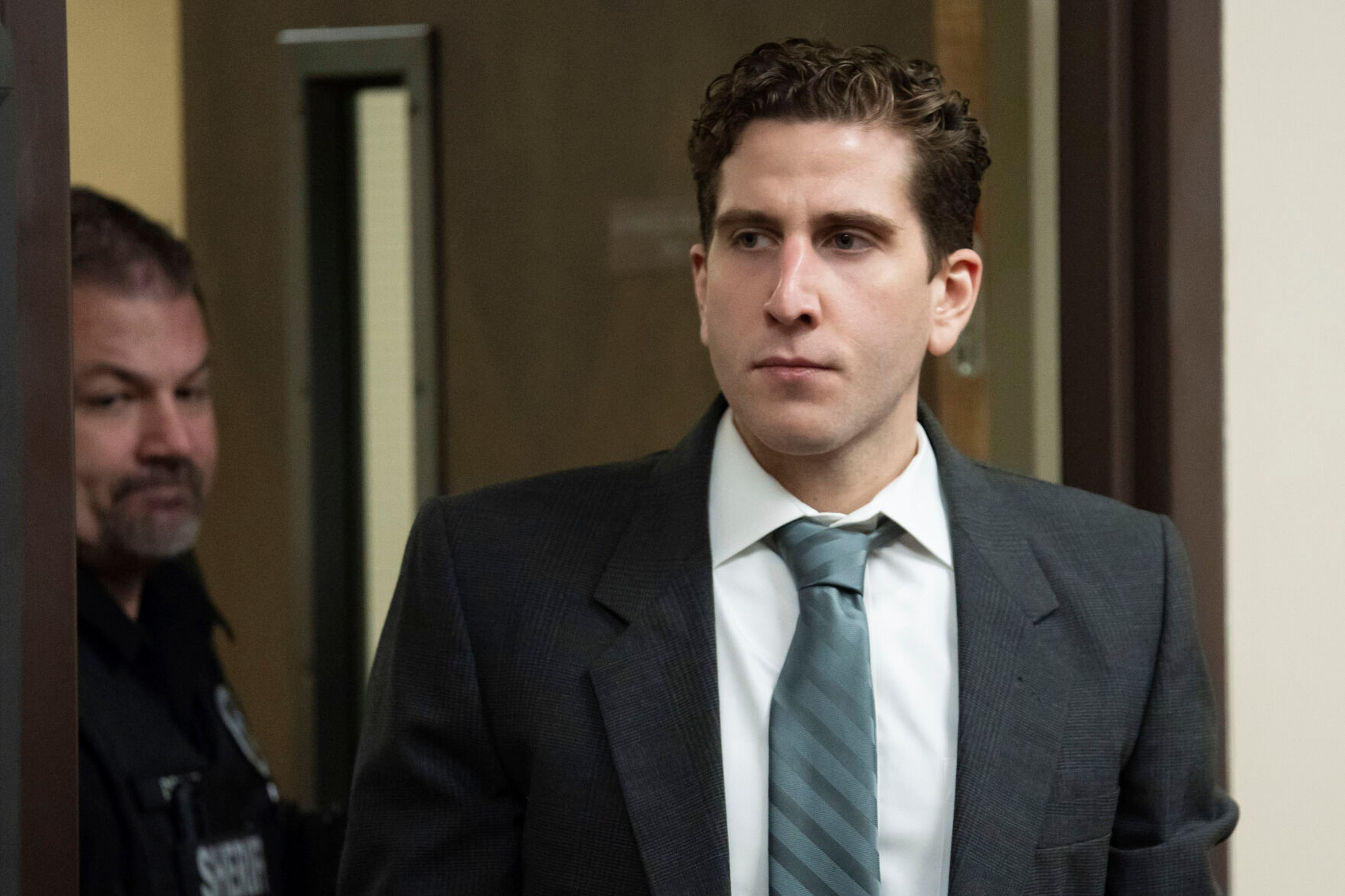 Bryan Kohberger, right, is escorted into a courtroom to appear at a hearing in Latah County District Court in September 2023 in Moscow. Kohberger's murder trial is now scheduled for Aug. 11, 2025, in Boise.