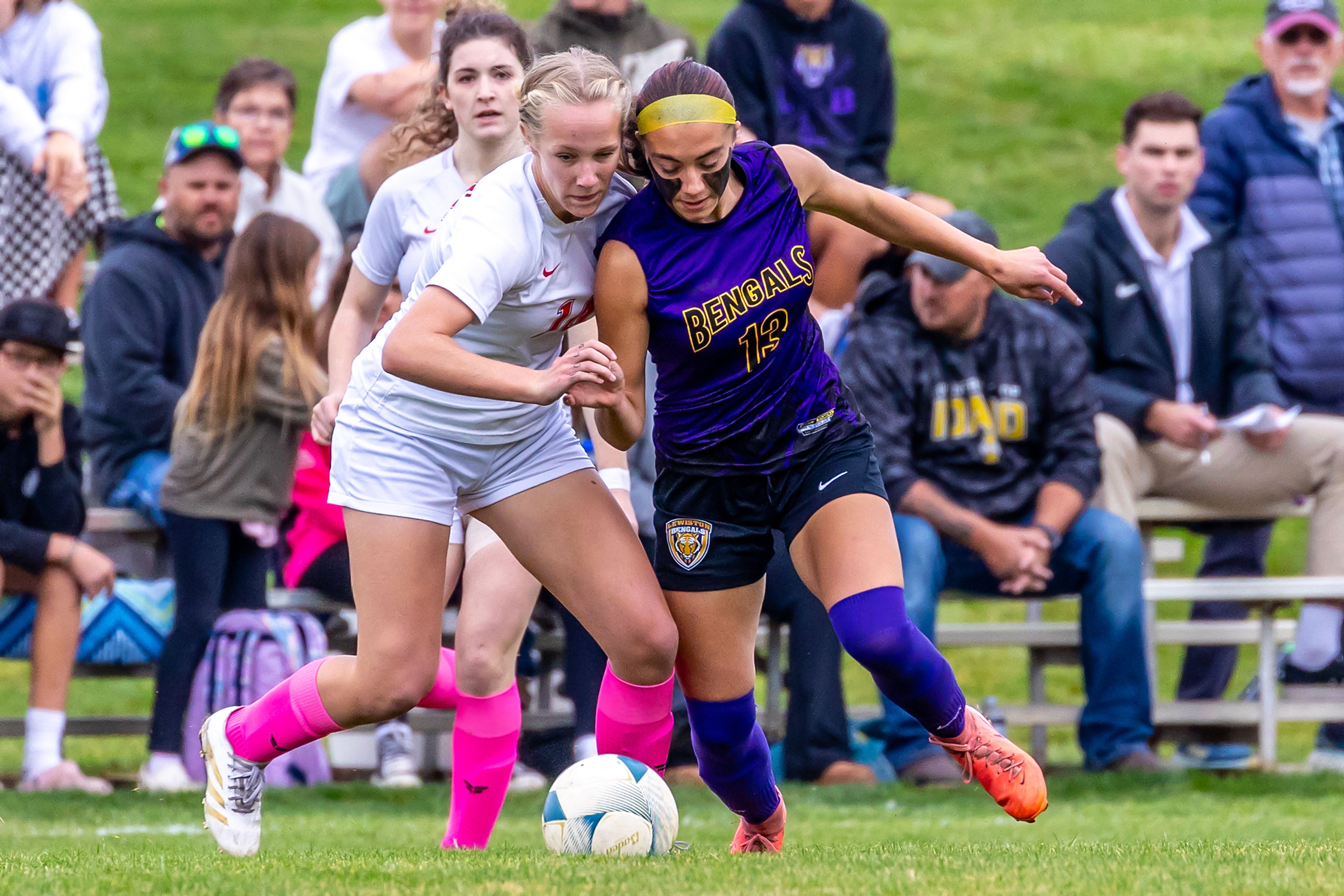 Lewiston�s Trinity Bonebrake competes with Sandpoint�s Cecilia Dignan in the 5A Inland Empire League District Championship Wednesday at Walker Field in Lewiston.,