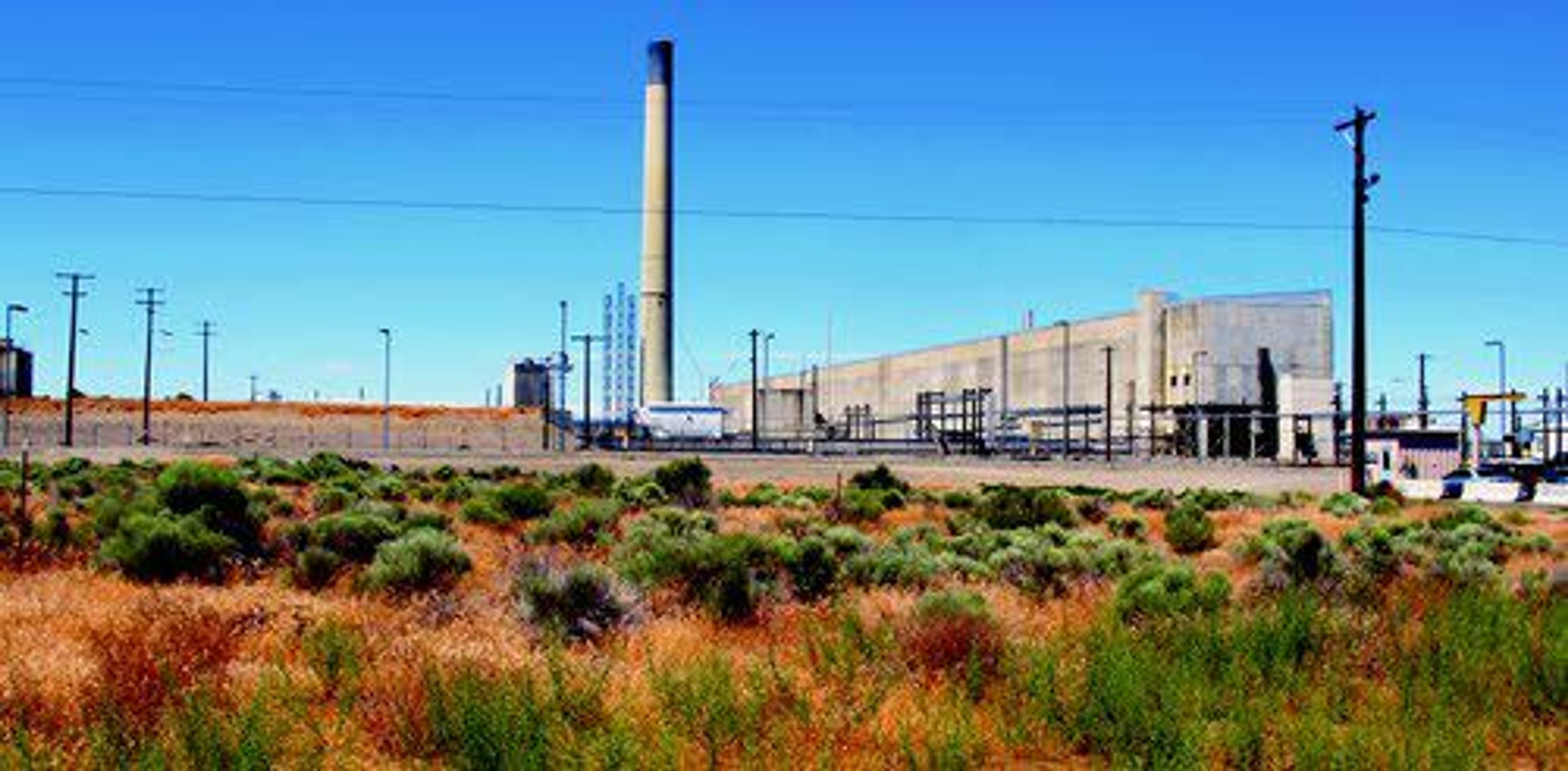 The Plutonium Uranium Finishing Plant (right) stands adjacent to a dirt-covered rail tunnel containing radioactive waste on the Hanford Nuclear Reservation near Richland.