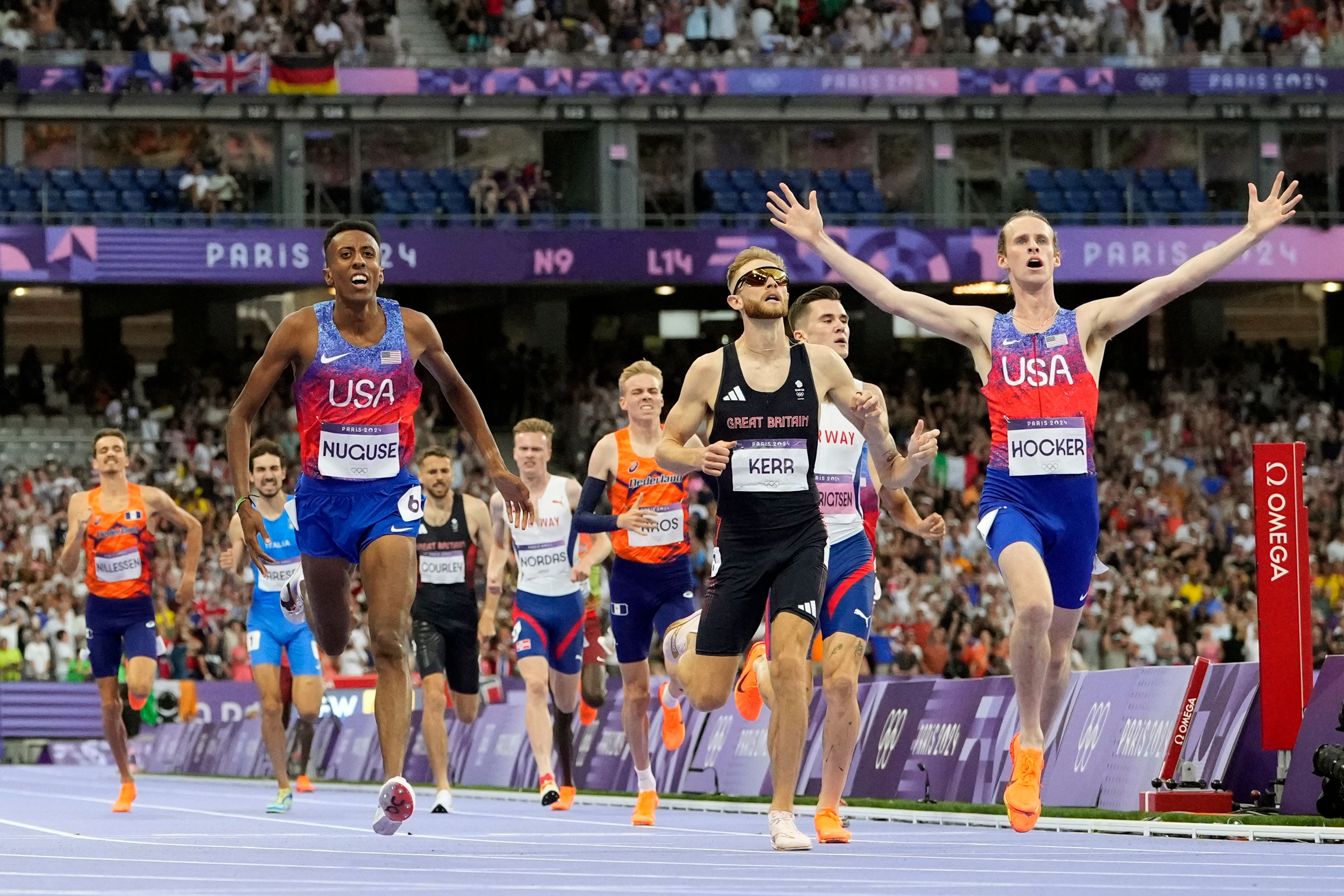 Cole Hocker, of the United States, celebrates after winning the men's 1500-meters final at the 2024 Summer Olympics, Tuesday, Aug. 6, 2024, in Saint-Denis, France. (AP Photo/Petr David Josek)