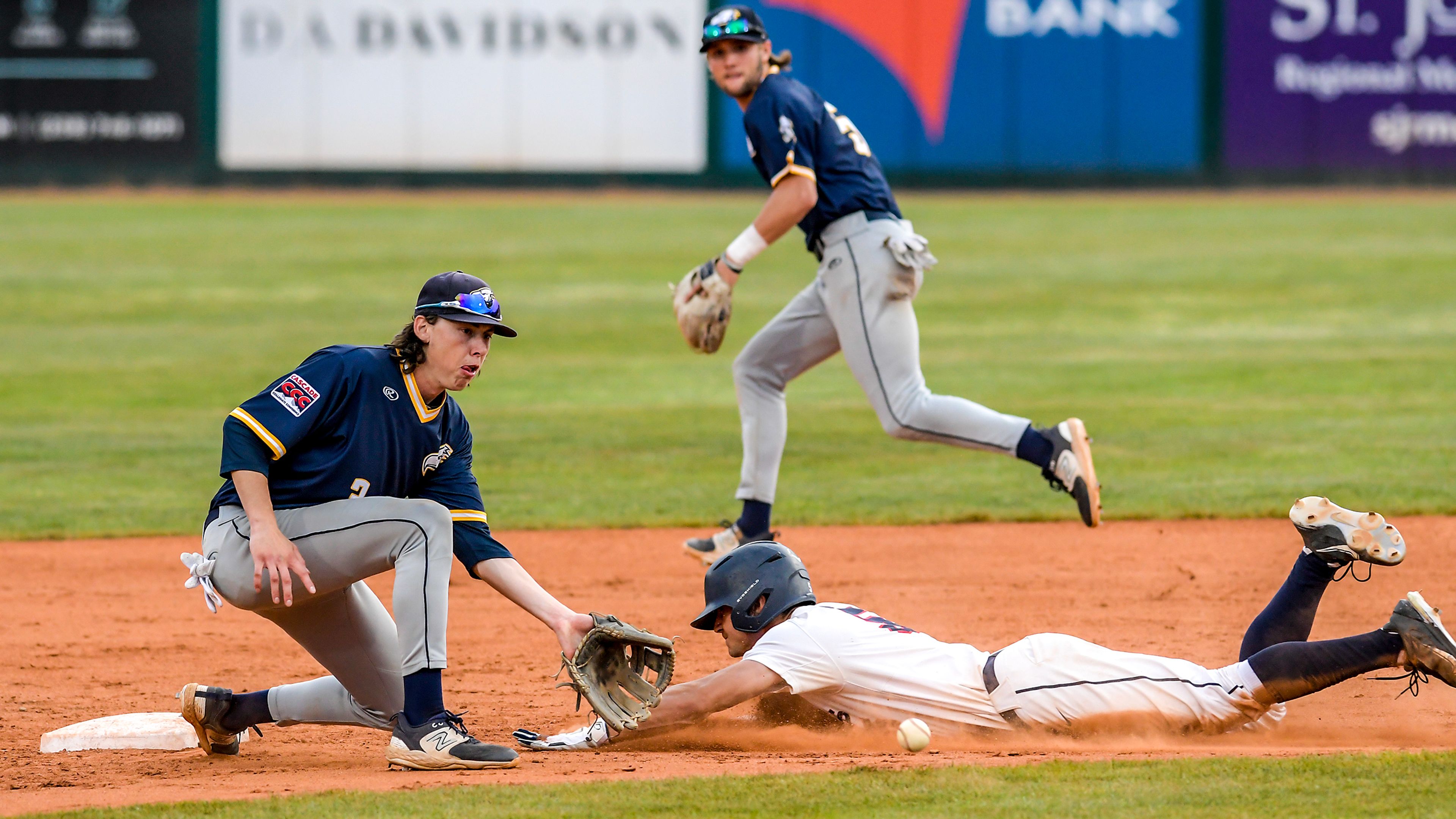 Lewis-Clark State’s Brandon Cabrera successfully steals second base as UBC shortstop David Draayers attempts to tag him out in an inning of a first round game of the NAIA Opening Round Monday at Harris Field in Lewiston.