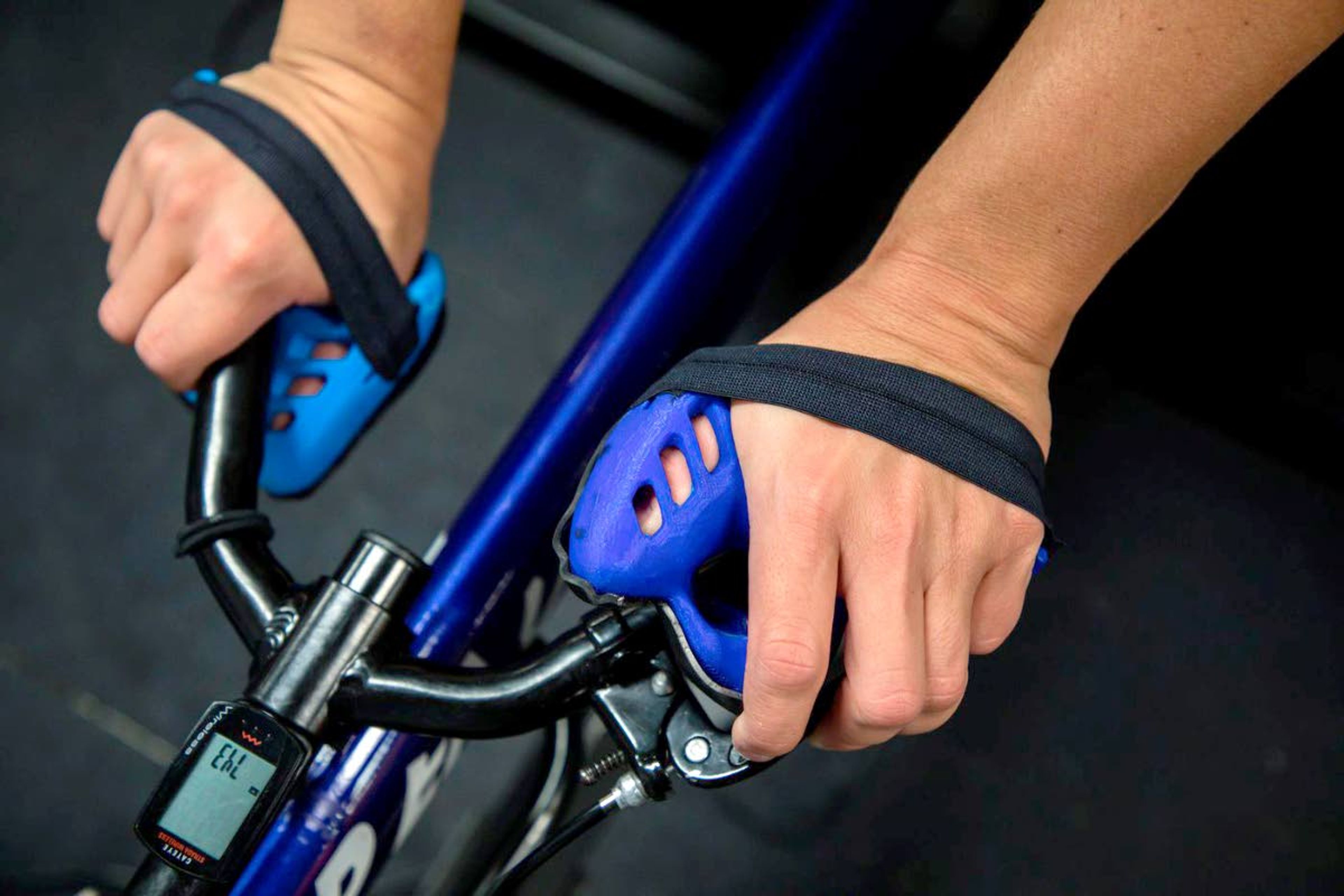 Arielle Rausin uses her custom wheelchair racing gloves during practice earlier this month.