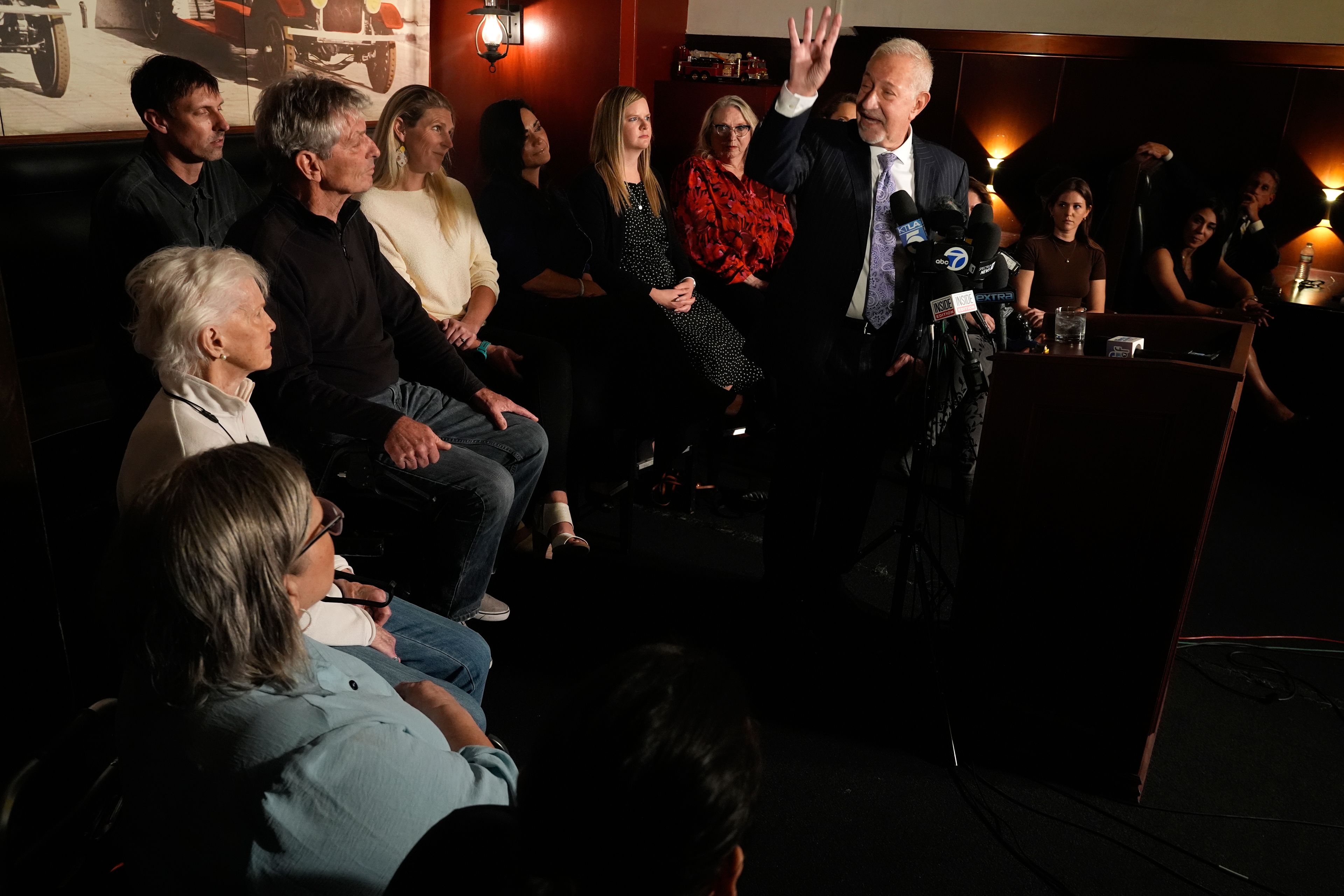 Mark Geragos defense attorney for Erik and Lyle Menendez surrounded by family members talks during a news conference on Thursday, Oct. 24, 2024, in Los Angeles. (AP Photo/Damian Dovarganes)