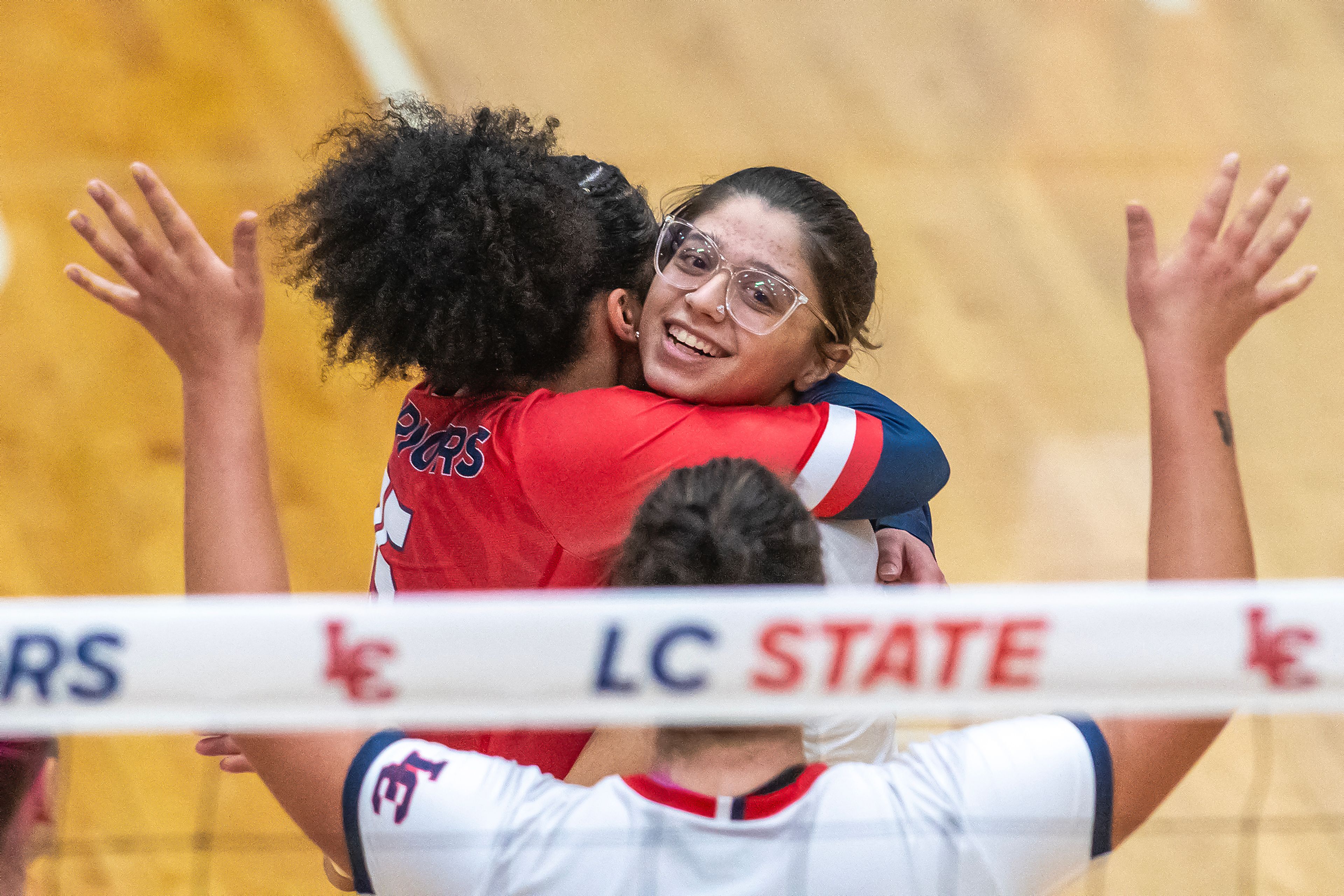 Lewis-Clark State players celebrate a point against Oregon Tech during a Cascade Conference Tournament play-in match Tuesday at Lewis-Clark State College.