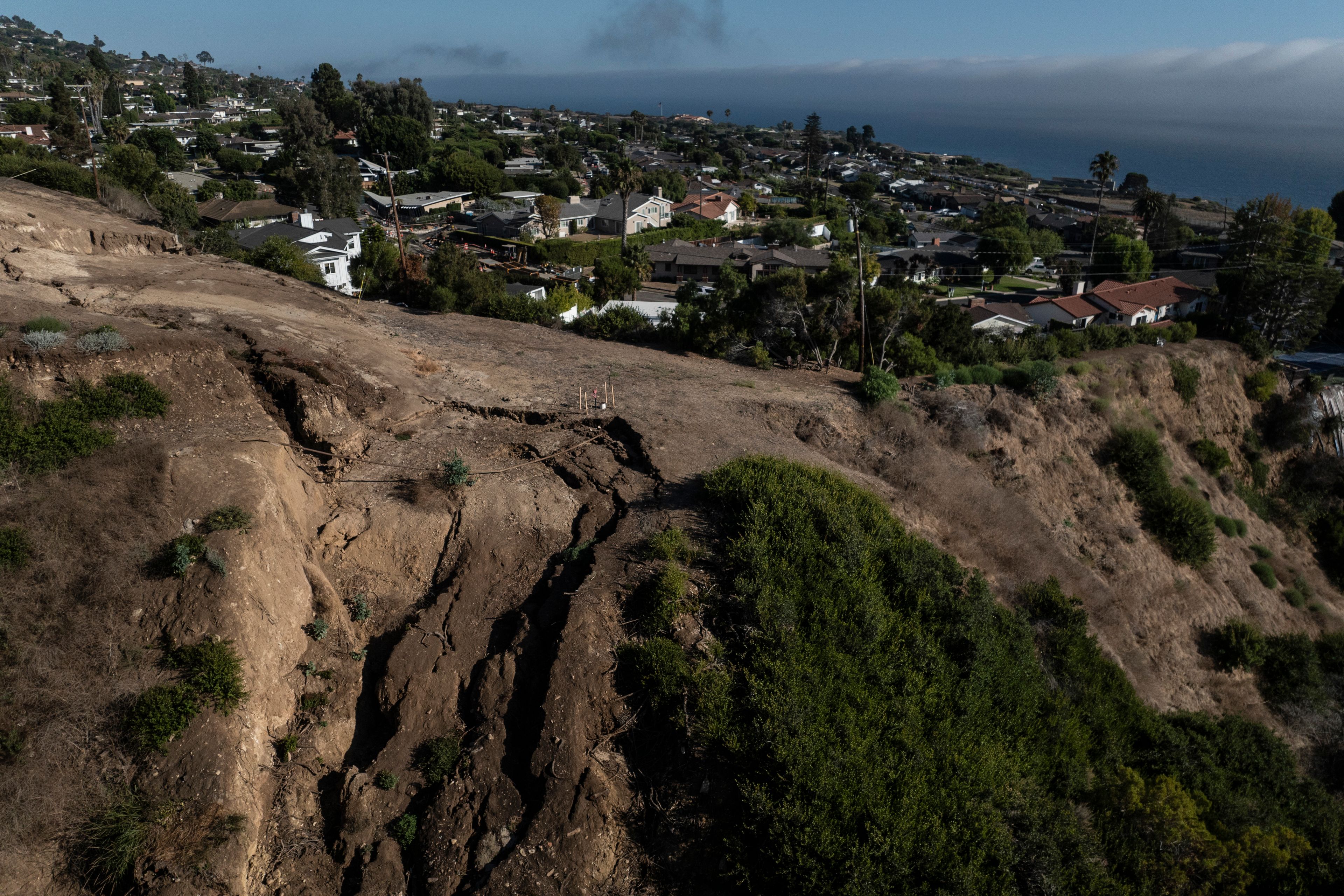 An aerial view shows a collapsed hillside due to ongoing landslides in Rancho Palos Verdes, Calif., Tuesday, Sept. 3, 2024.