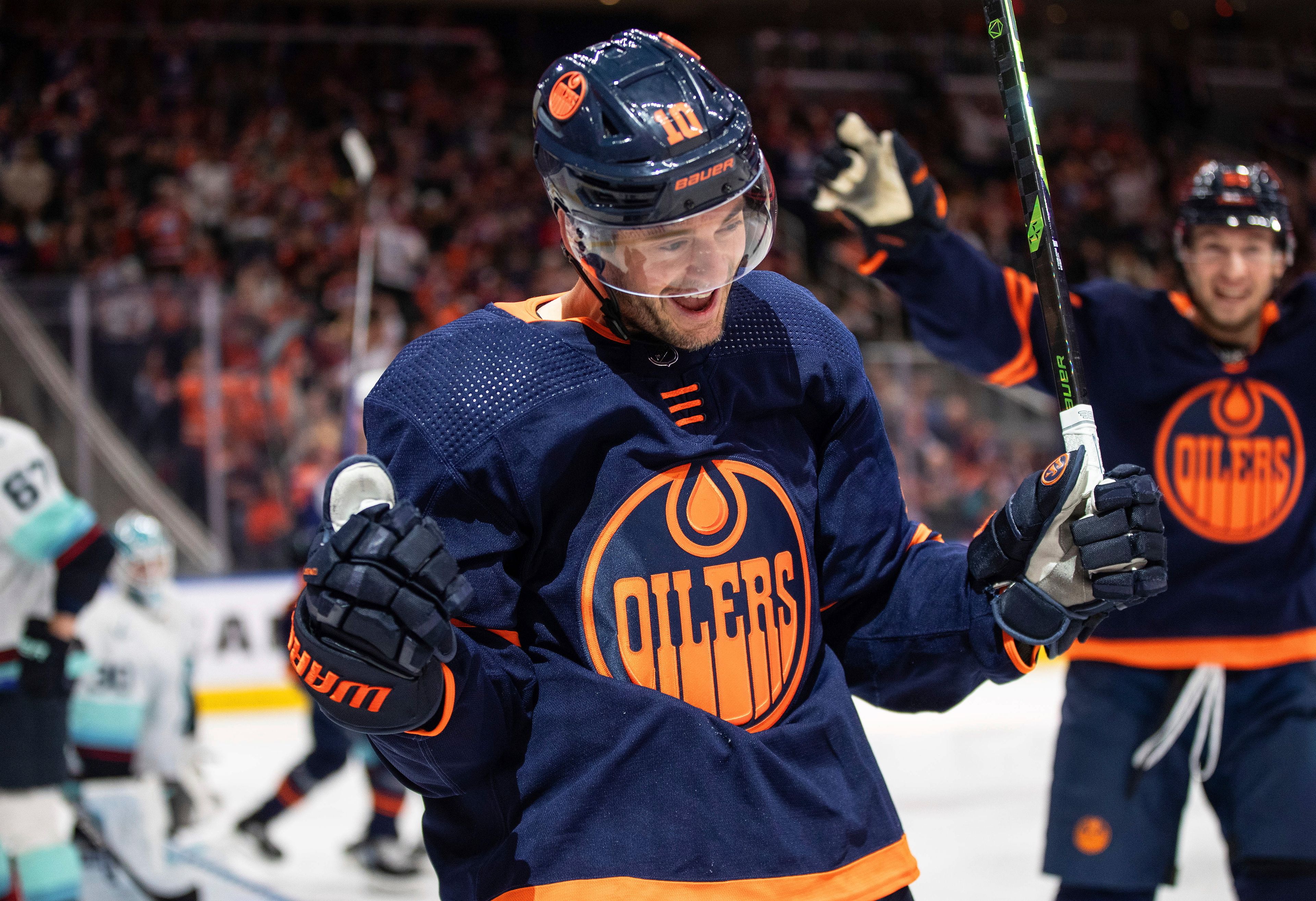 Edmonton Oilers' Derek Ryan (10) celebrates a goal against the Seattle Kraken during the second period of an NHL hockey game Tuesday, Jan. 17, 2023, in Edmonton, Alberta. (Jason Franson/The Canadian Press via AP)