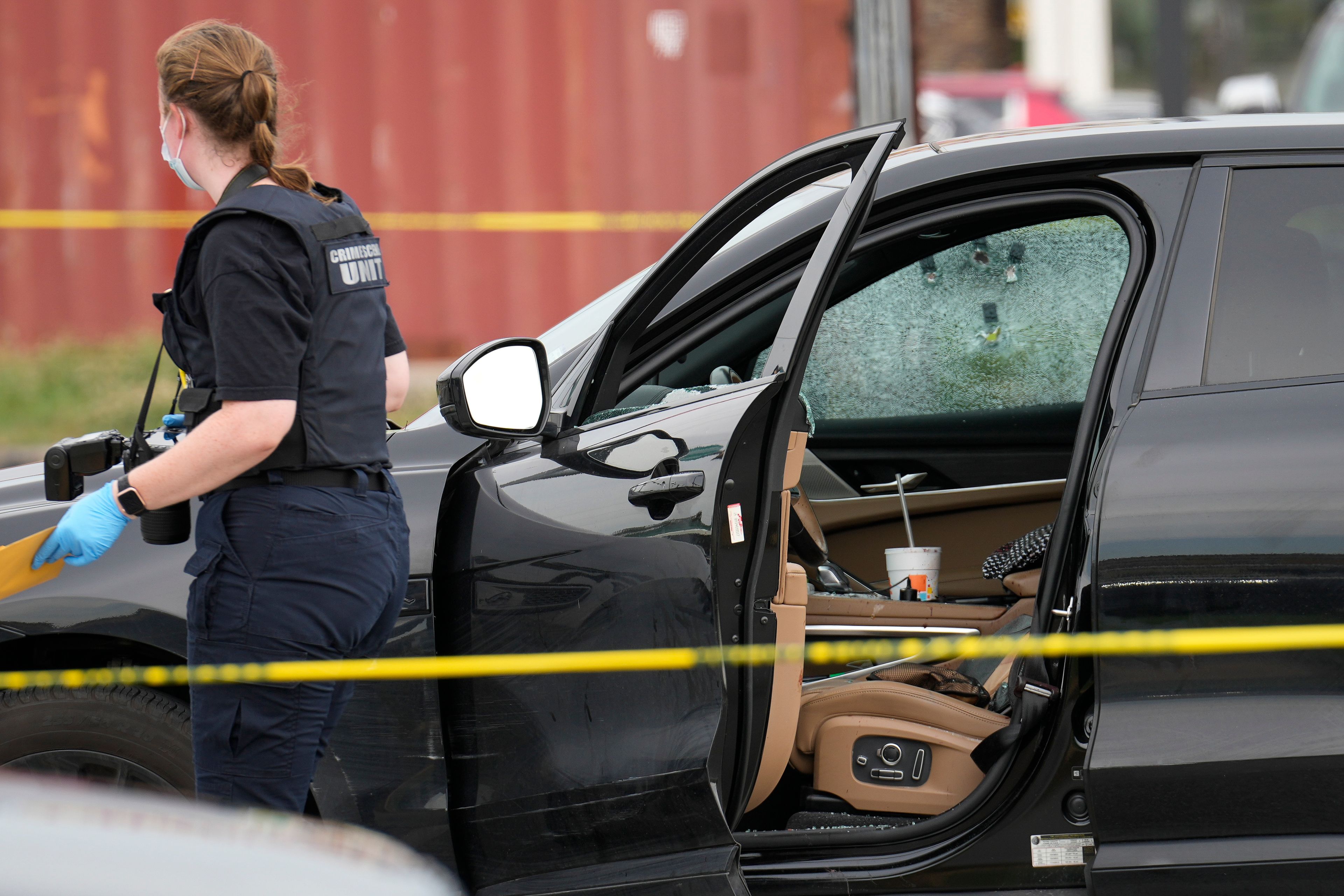 A Houston Forensic Science Center Crime Scene Unit member investigates the scene after Harris County deputy constable Maher Husseini was shot and killed Tuesday, Sept. 3, 2024, in Houston.