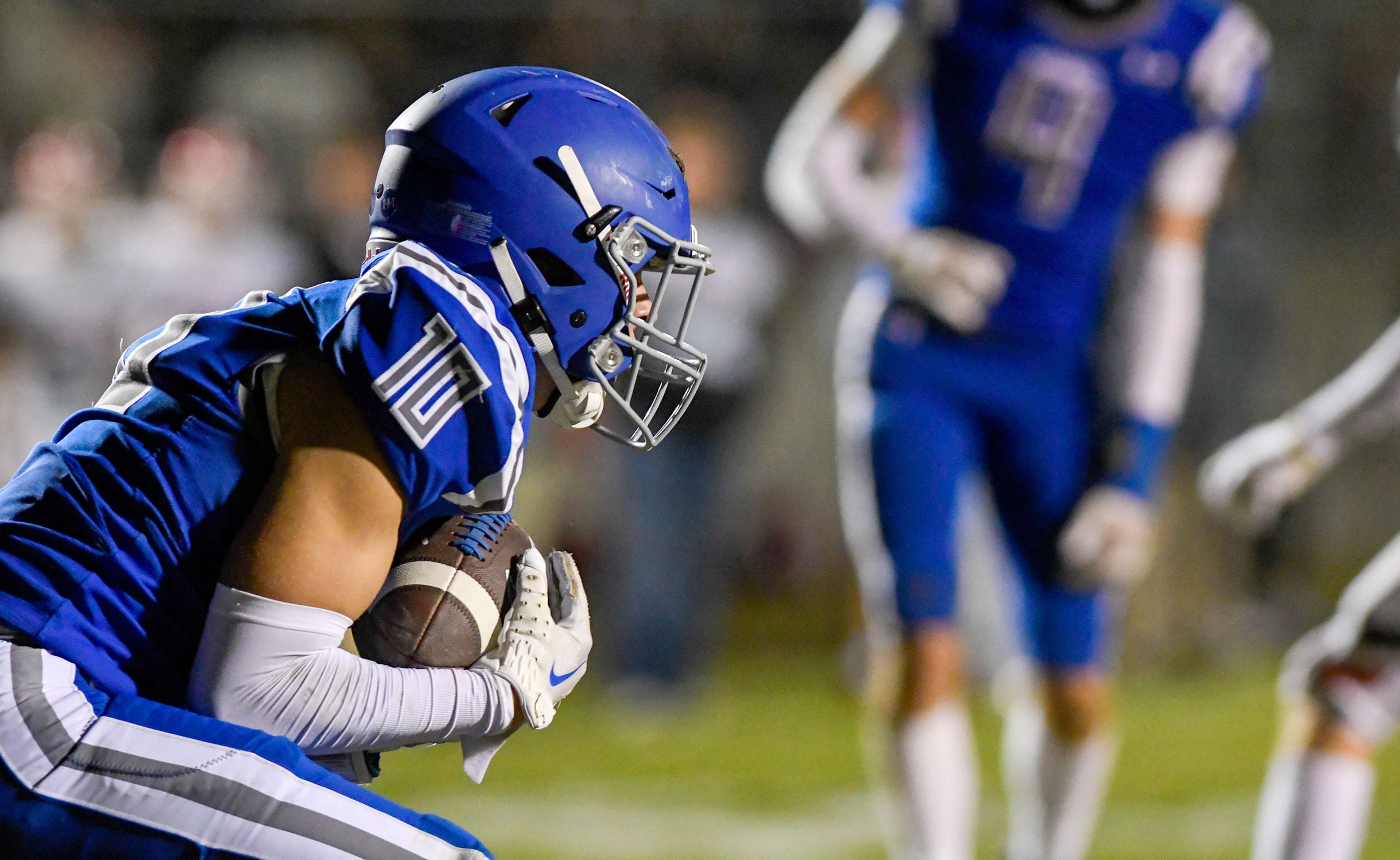 Pullman�s Caleb Ratliff completes a touchdown pass during a game against Clarkston Friday in Pullman.,