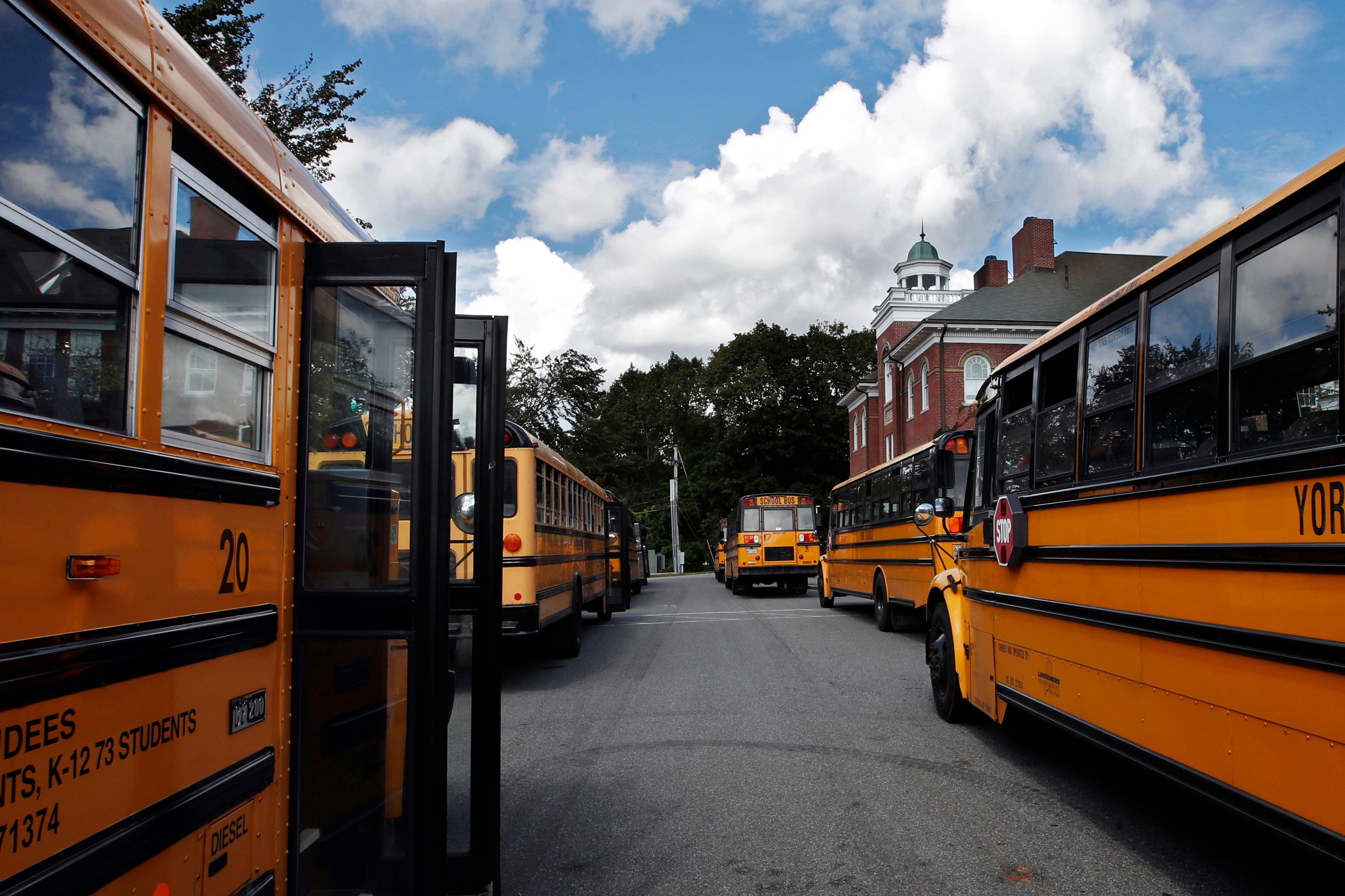 In this Thursday, Sept. 14, 2017, file photo, buses await students at York Middle School in York, Maine.