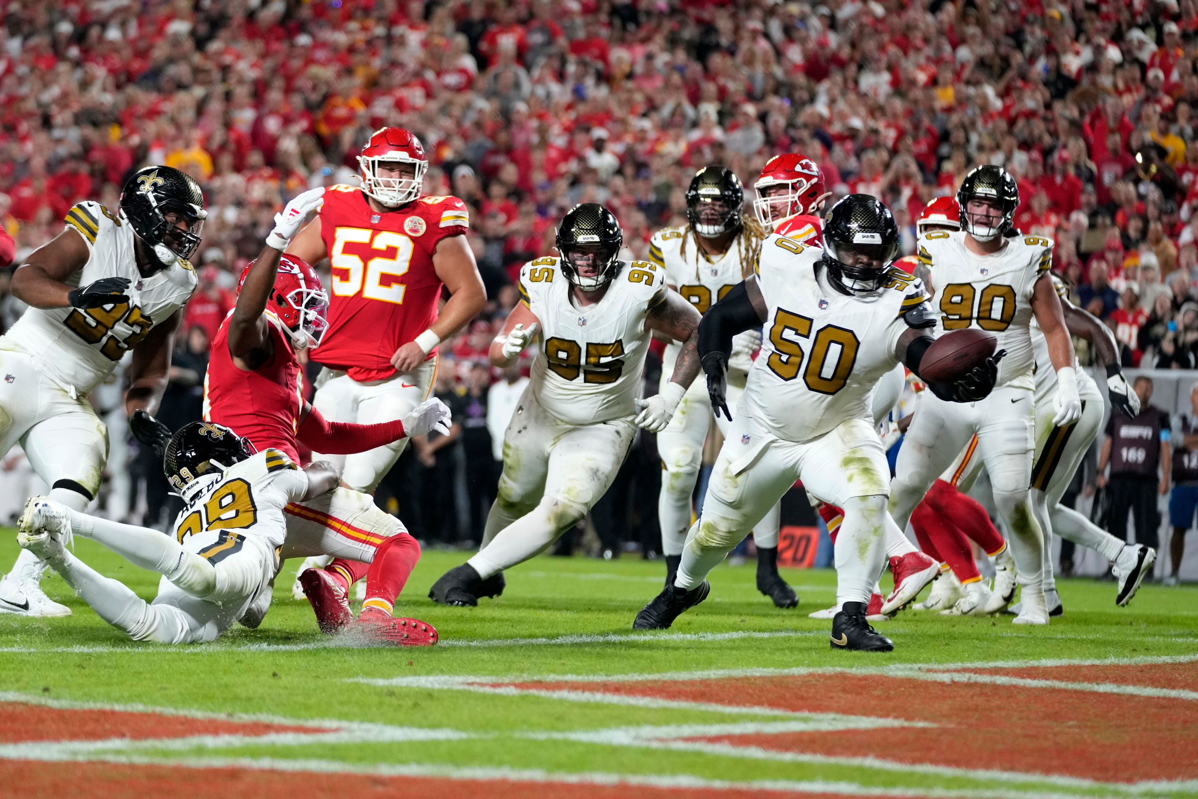 New Orleans Saints defensive tackle Khalen Saunders (50) intercepts a pass in the end zone during the second half of an NFL football game against the Kansas City Chiefs Monday, Oct. 7, 2024, in Kansas City, Mo. (AP Photo/Ed Zurga)