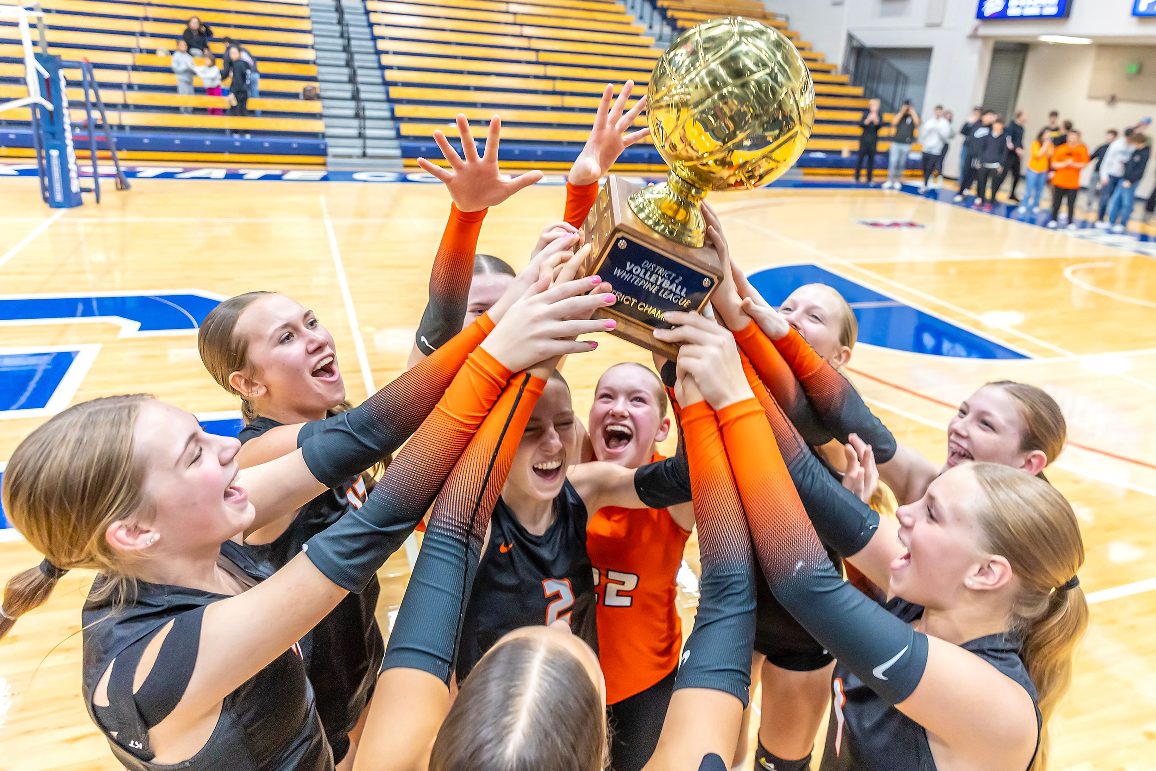 Troy celebrates following its defeat of Potlatch to win an Idaho 2A district volleyball championship on Oct. 23 at the P1FCU Activity Center in Lewiston.