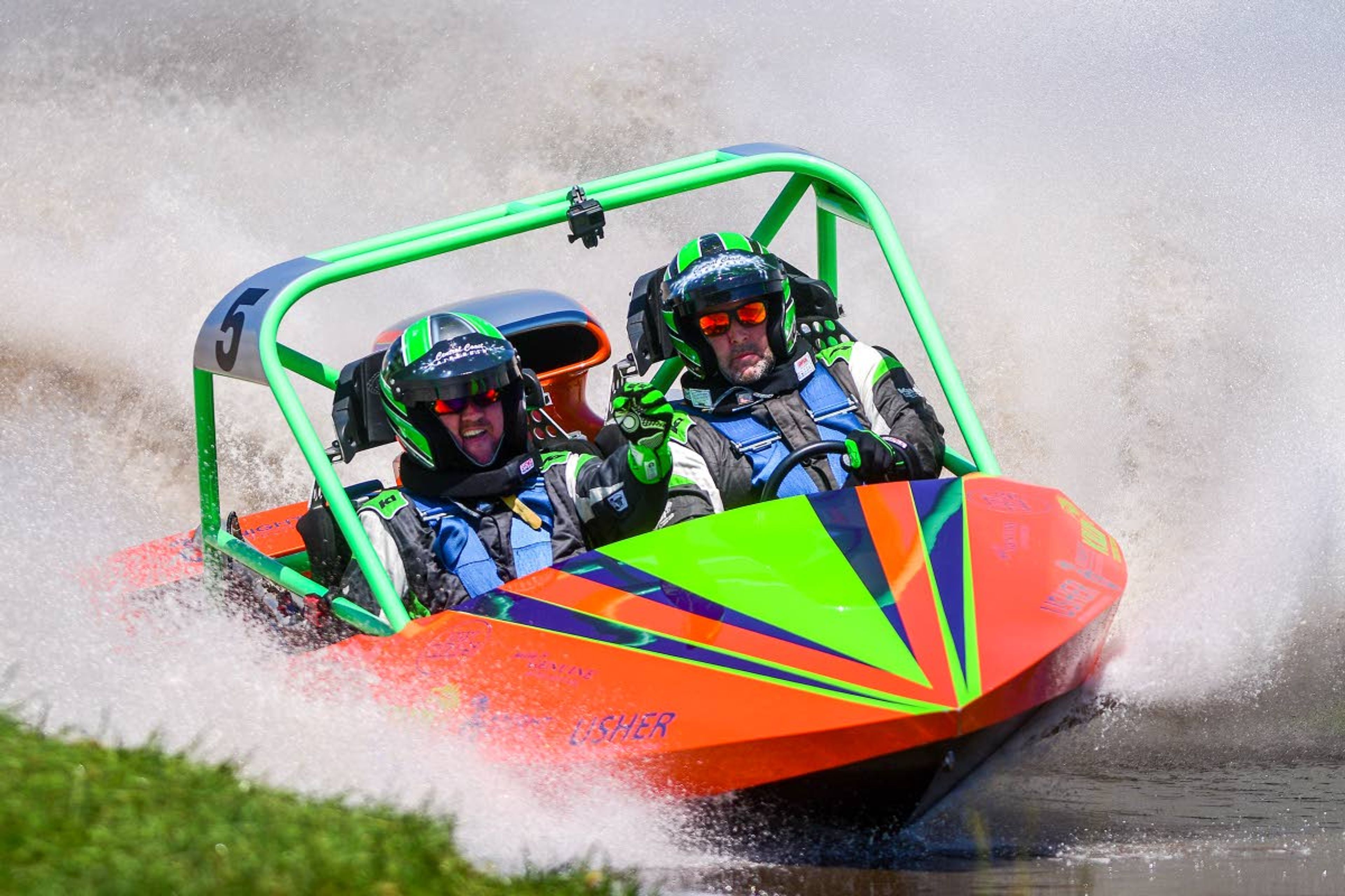 Showtime’s Dennis Robertson (left) relays directions to driver Kelley Stevenson as they maneuver the twists and turns of Webb’s Slough during the sprint boat races on Saturday in St. John.