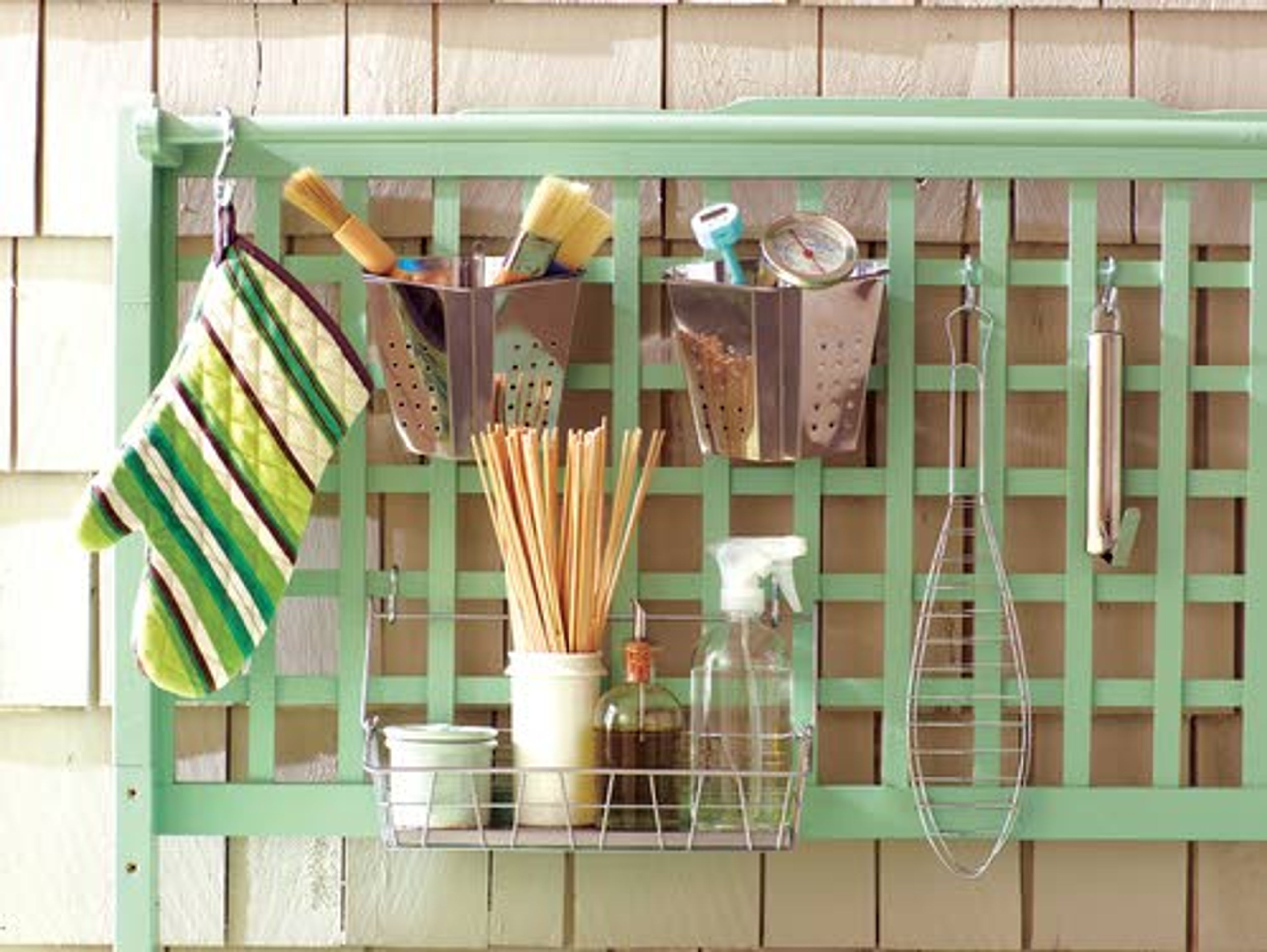 Keep grilling essentials like potholders, skewers and basting brushes close at hand by hanging them from a lattice.