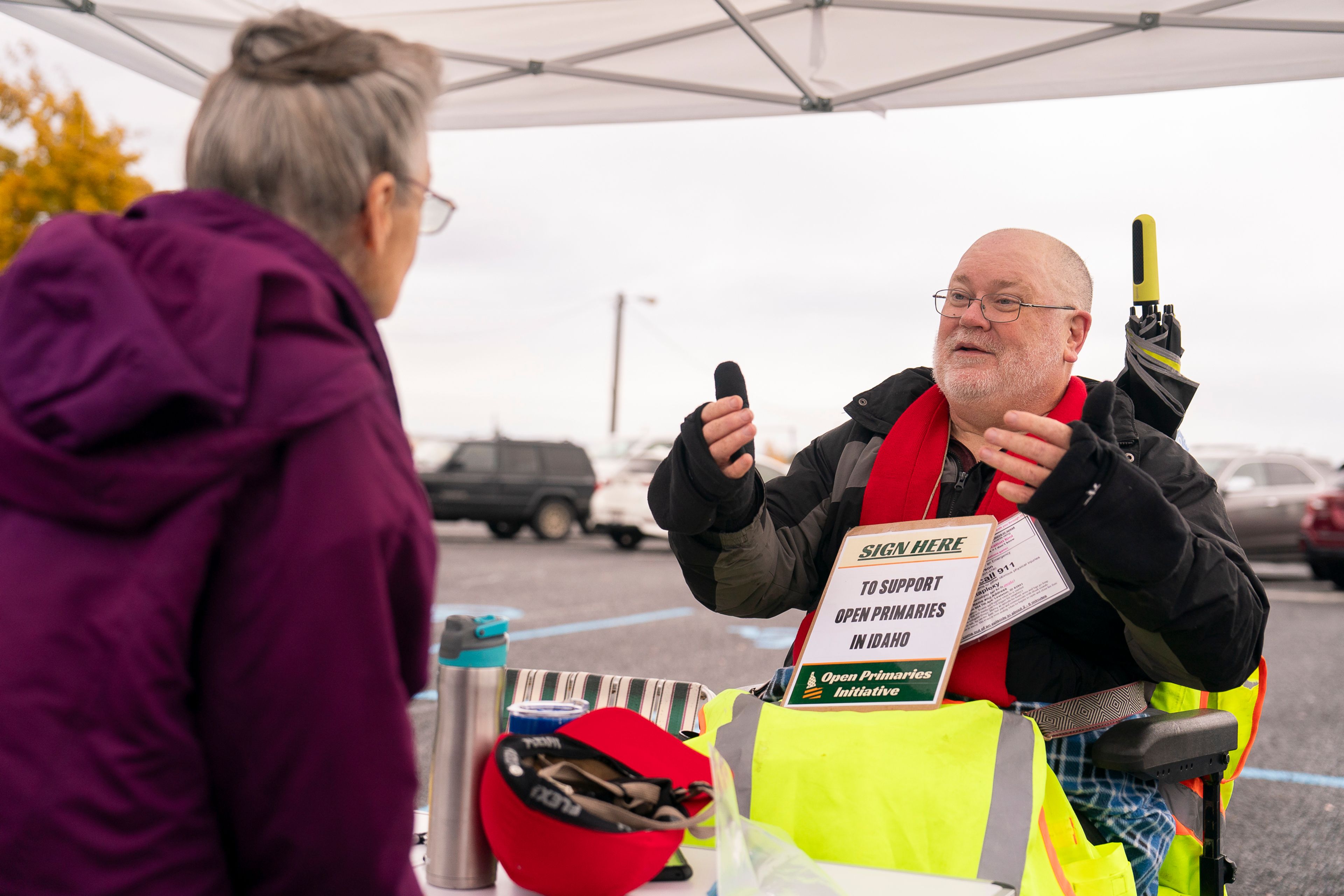 File -- Eric Peterson, right, speaks about open primaries outside of the Nez Perce County Fair Pavilion in Lewiston last November.