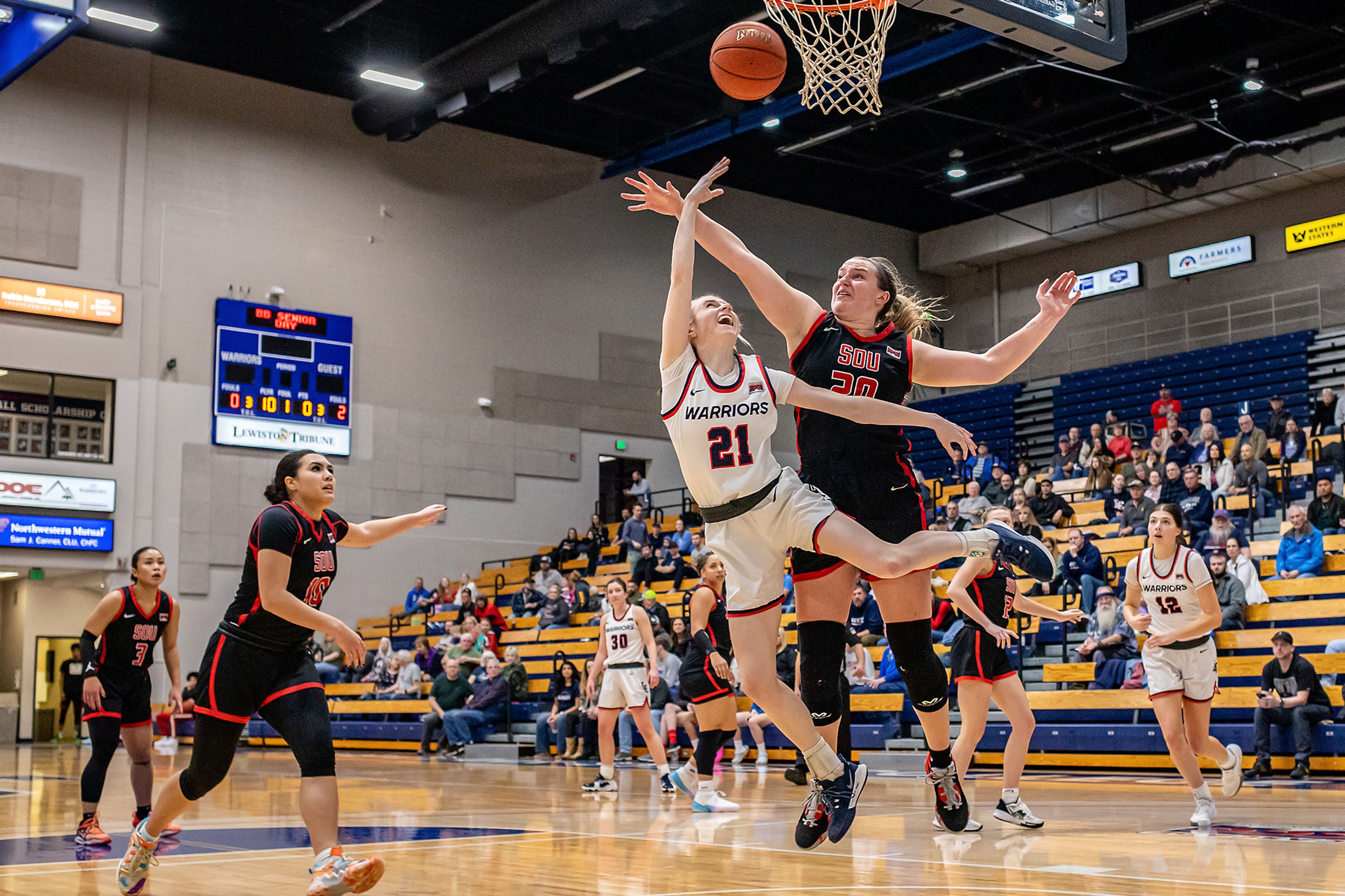 Lewis-Clark State guard Callie Stevens, center, shoots during Saturday’s Cascade Conference game against Southern Oregon at the P1FCU Activity Center.