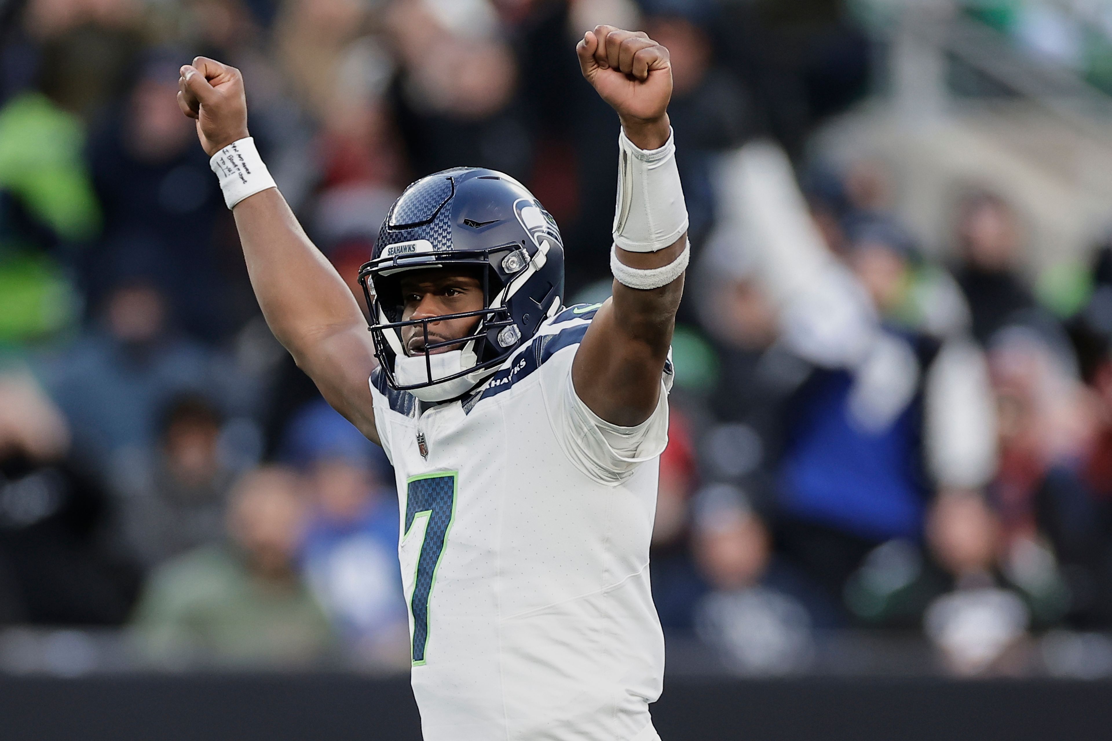 Seattle Seahawks quarterback Geno Smith (7) reacts after a touchdown by running back Zach Charbonnet during the fourth quarter of an NFL football game against the New York Jets, Sunday, Dec. 1, 2024, in East Rutherford, N.J. (AP Photo/Adam Hunger)