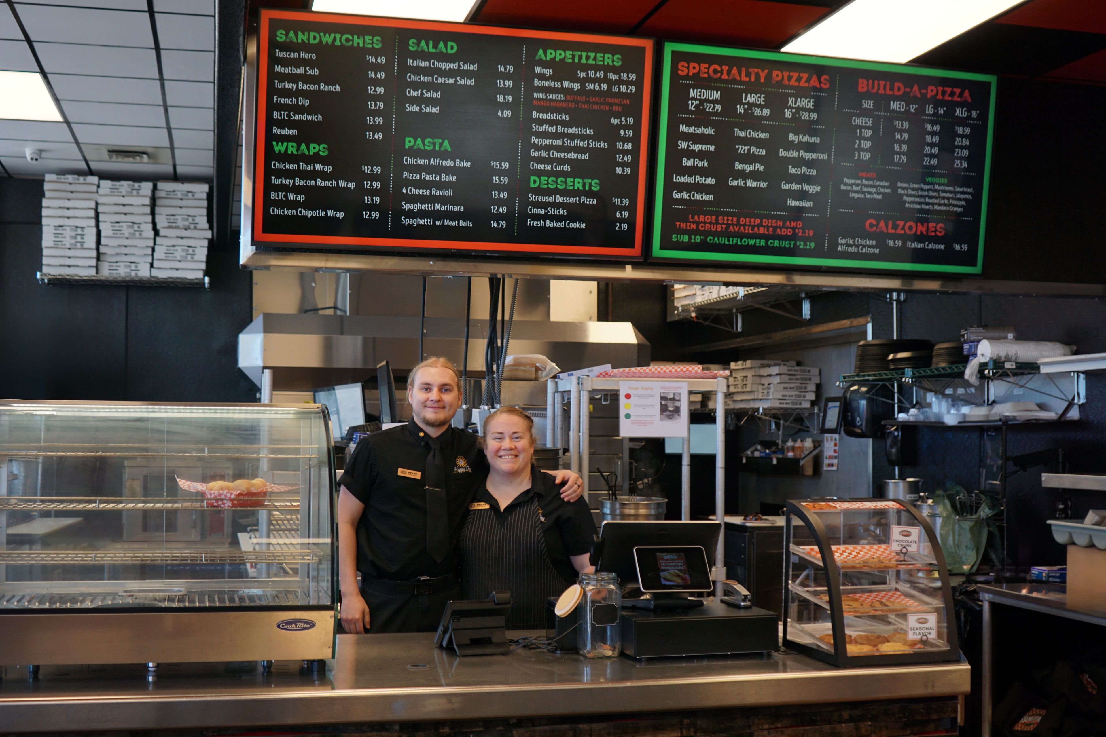 Dylan McKelway, the general manager of Southway on Thain, poses for a picture with Tricia Gaskill, the general manager of Southway Pizzaria and Deli at the Orchards location of the restaurant.