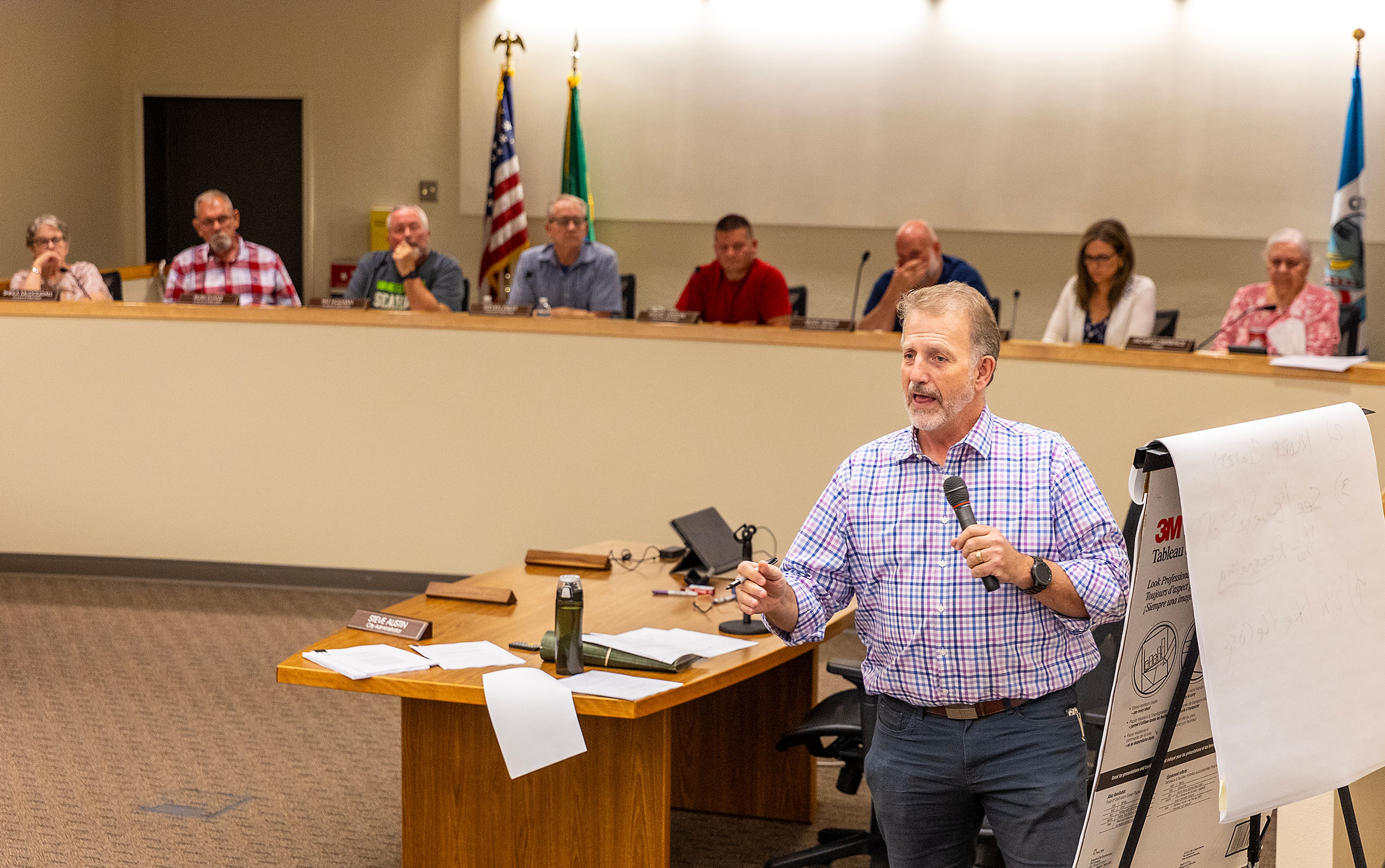 Interim City Attorney Todd Richardson gives a presentation about the lawsuit the City of Clarkston and other cities are facing during a city council meeting Monday in Clarkston.