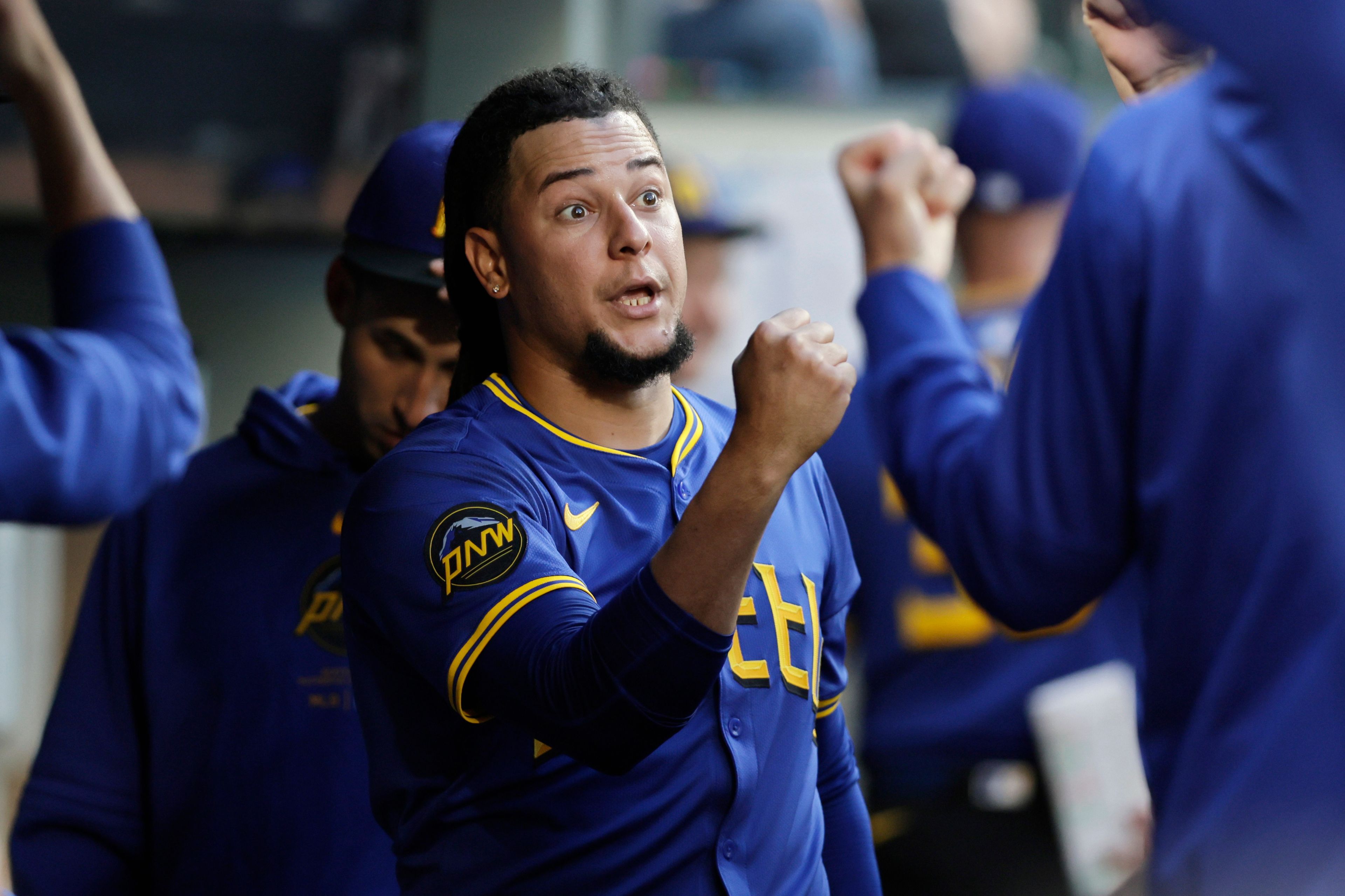 Seattle Mariners starting pitcher Luis Castillo is greeted in the dugout after leaving during the seventh inning against the Toronto Blue Jays in a baseball game Friday, July 5, 2024, in Seattle. (AP Photo/John Froschauer)