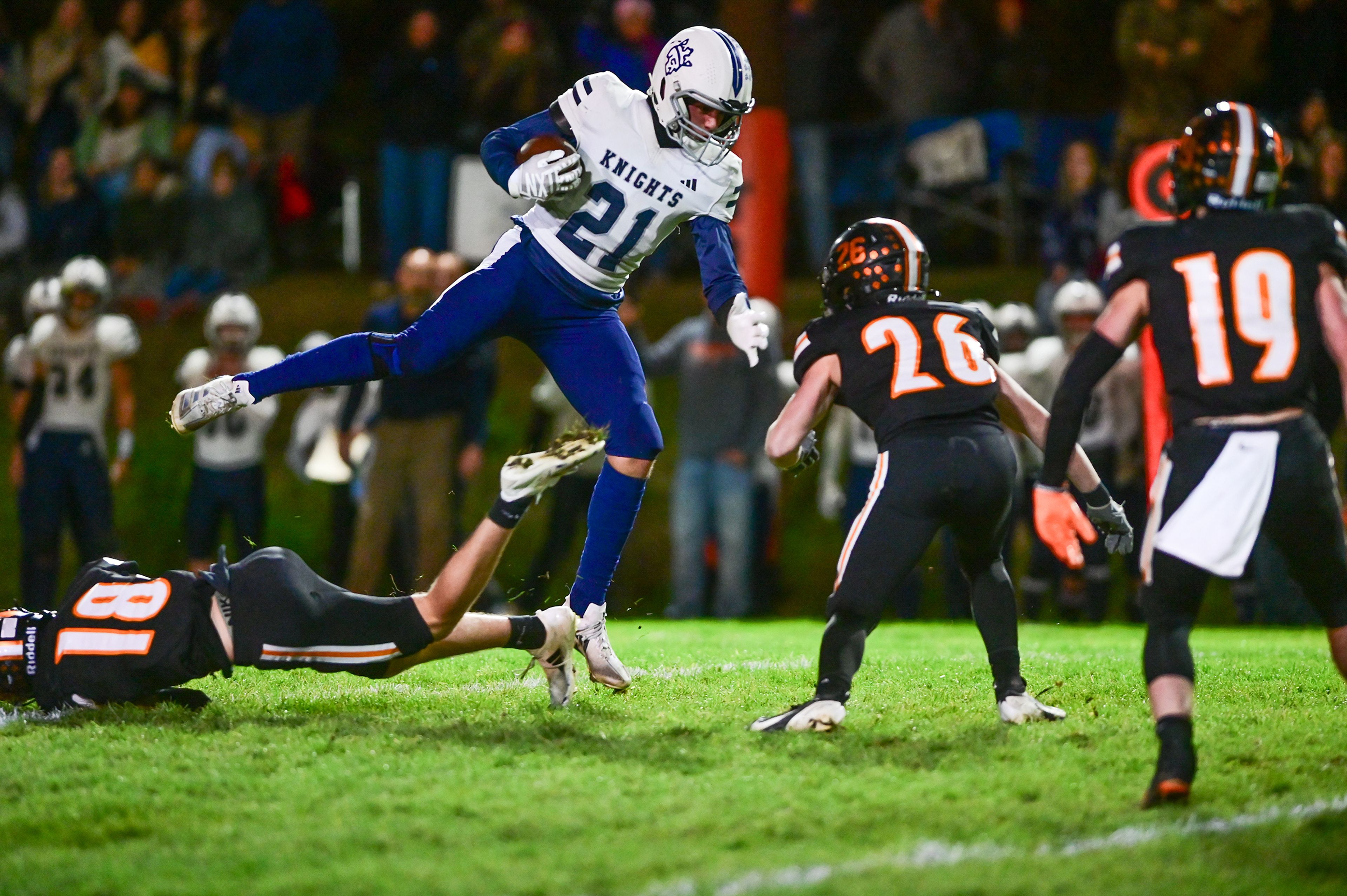 Logos Baxter Covington dodges Kendrick defenders Cade Silflow and Orion Stewart Friday in Kendrick.,