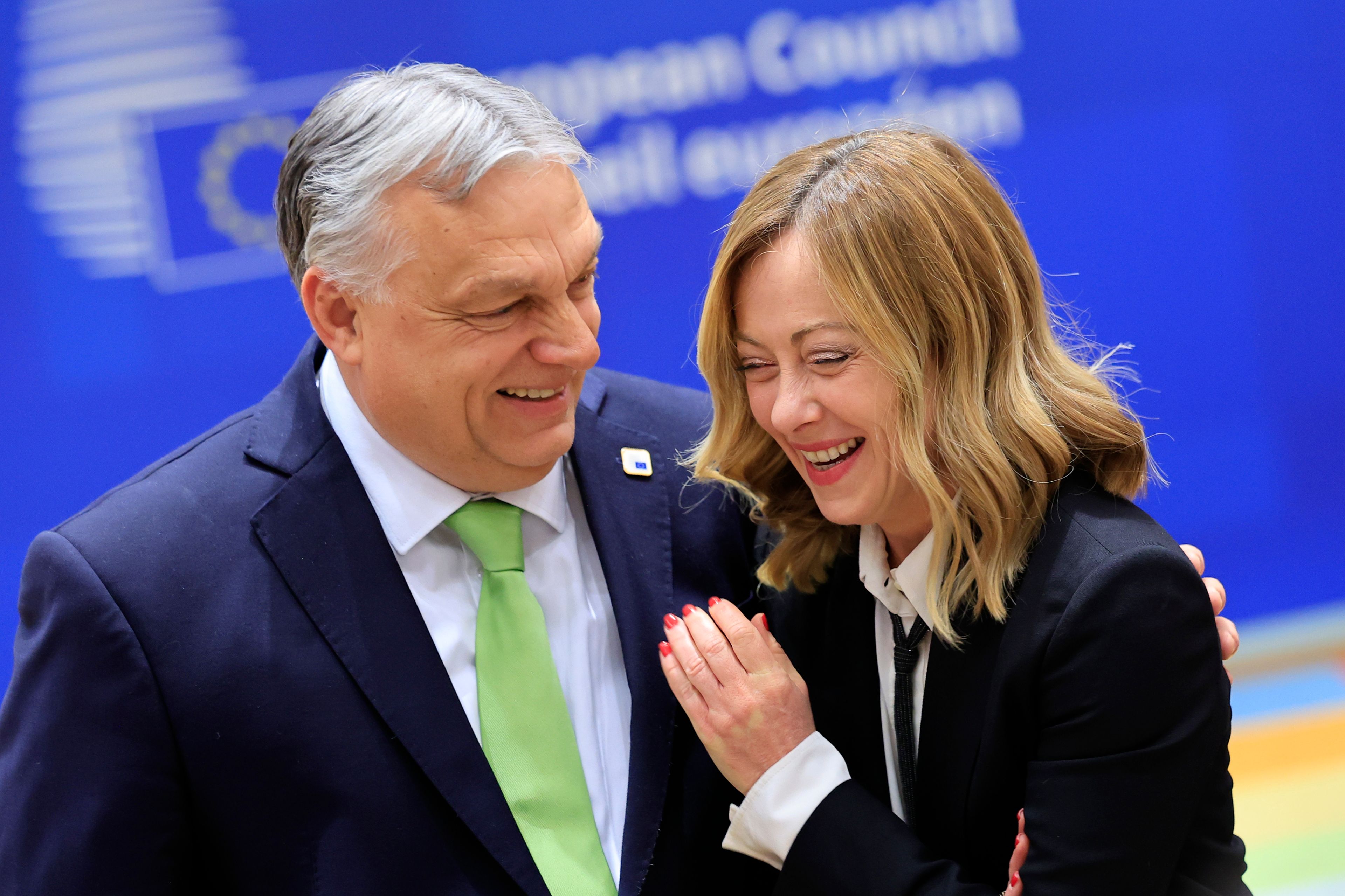 FILE - Hungary's Prime Minister Viktor Orban, left, speaks with Italy's Premier Giorgia Meloni during a round table meeting at an EU Summit in Brussels, on March 21, 2024. It seemed like a throwaway line by European Commission President Ursula von der Leyen, yet it encapsulated what is at stake for many in this week's European Union parliamentary elections — What to do with the hard right? And should it be trusted?