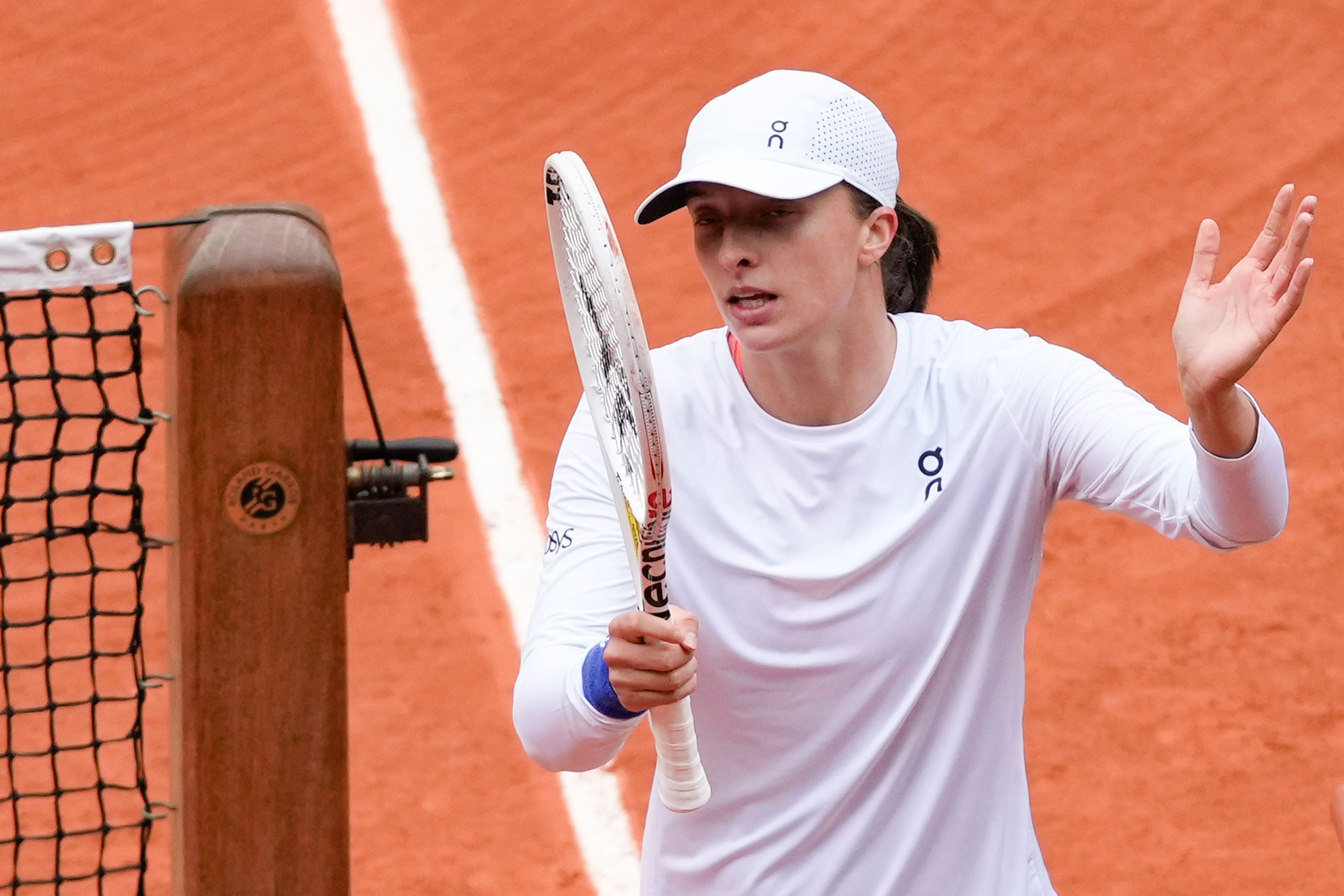 Poland's Iga Swiatek celebrates after defeating Russia's Anastasia Potapova during their fourth round match of the French Open tennis tournament at the Roland Garros stadium in Paris, Sunday, June 2, 2024.