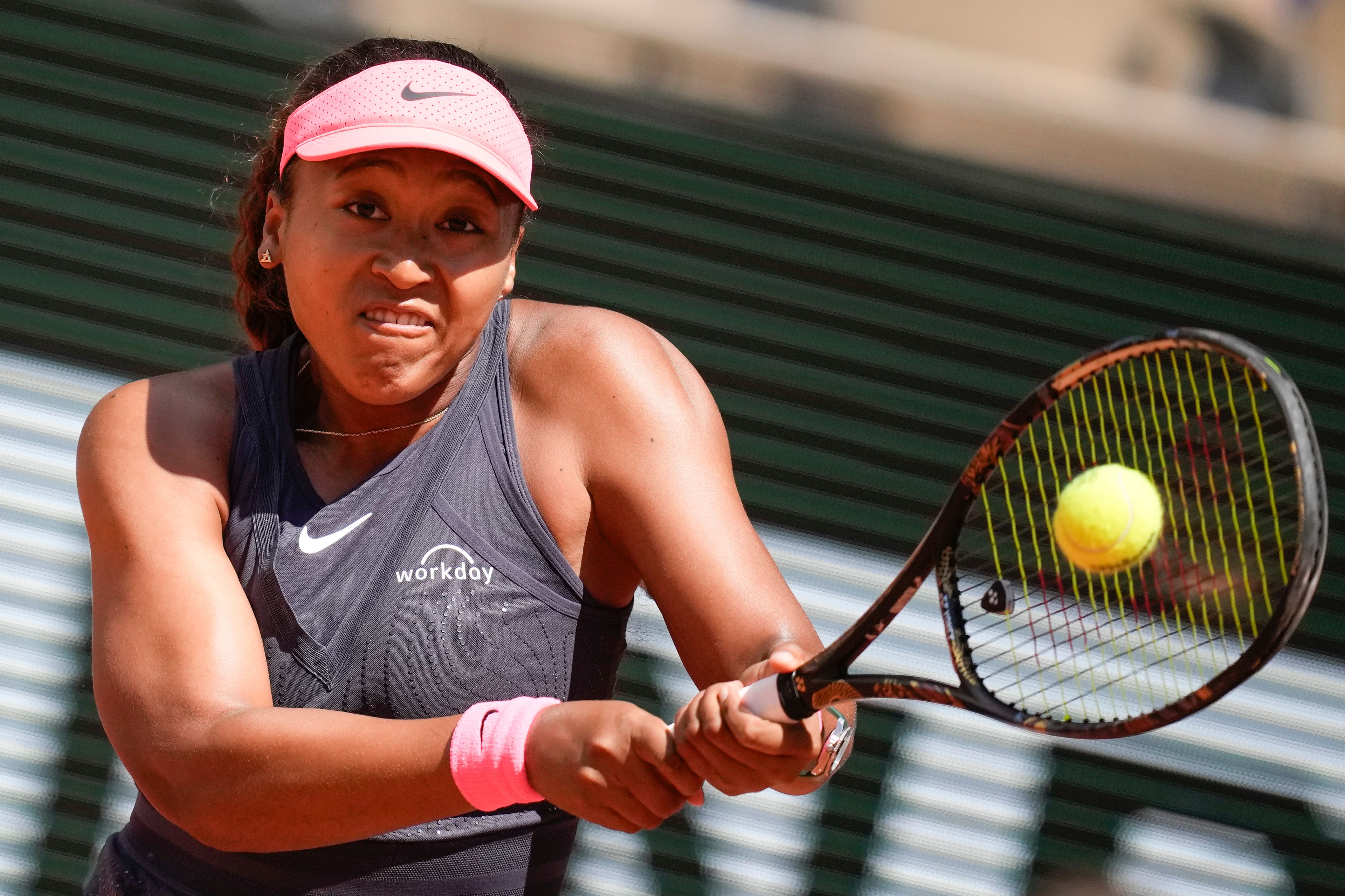 Japan's Naomi Osaka plays a shot against Italy's Lucia Bronzetti during their first round match of the French Open tennis tournament at the Roland Garros stadium in Paris, Sunday, May 26, 2024.