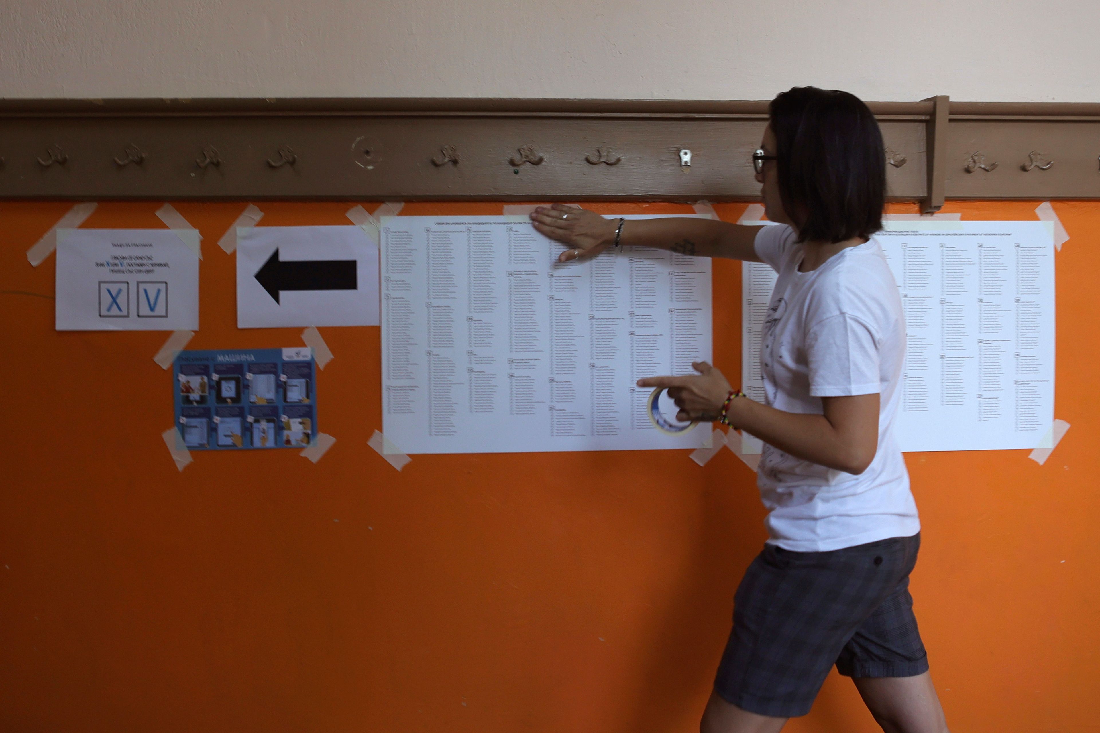 An election commission worker prepares a polling station in Bankya, on the outskirts of Sofia, Sunday, June 9, 2024. Voters in Bulgaria are going to the polls on Sunday in national and European elections that have been overshadowed by political instability, economic inequality and growing concern over the war in nearby Ukraine.