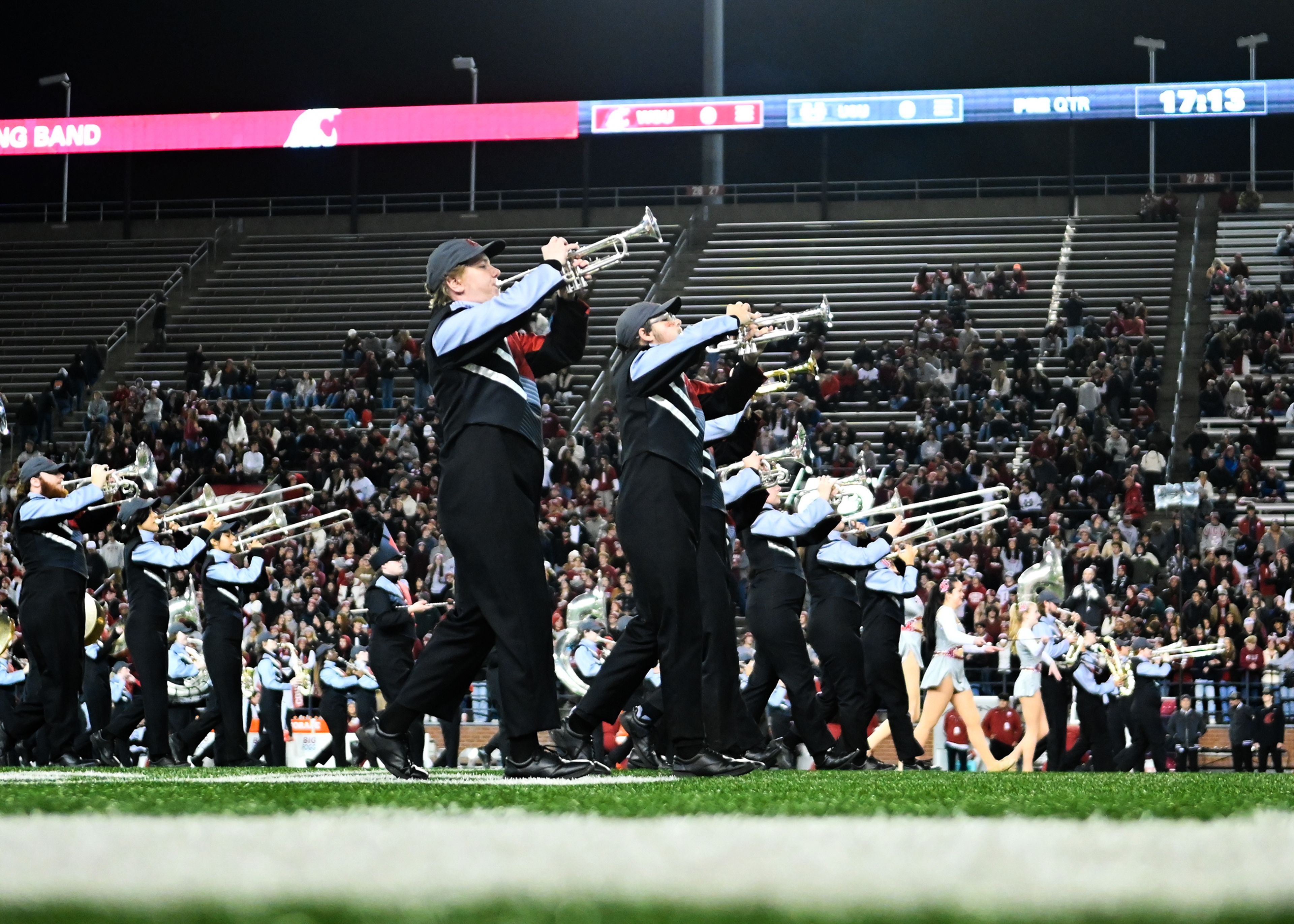 The Washington State Cougar Marching Band takes Gesa Field Saturday before a Washington State game against Utah State in Pullman.