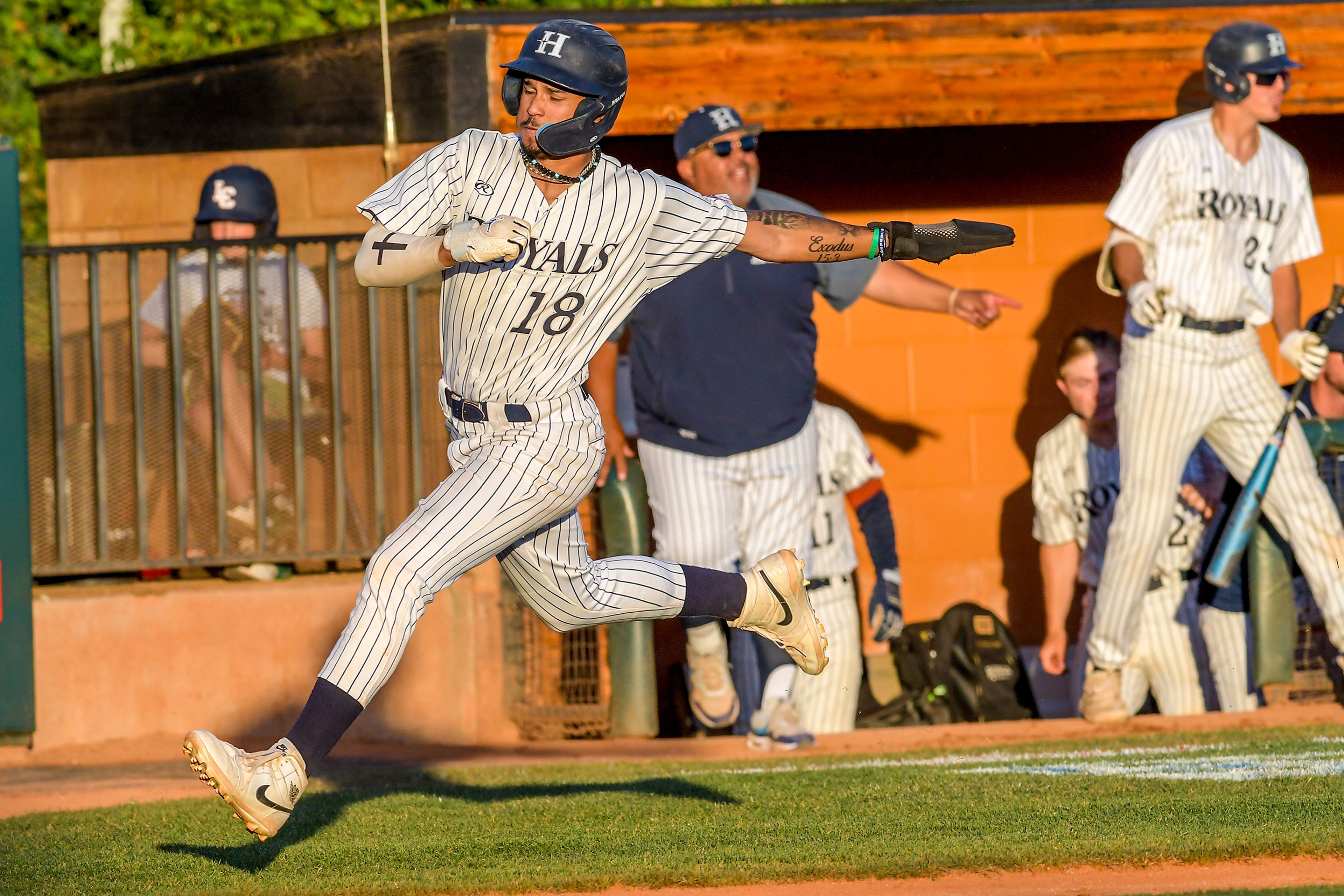 Hope International’s Amari Bartee runs into home to score a run against Tennessee Wesleyan in Game 19 of the NAIA World Series at Harris Field Friday in Lewiston.