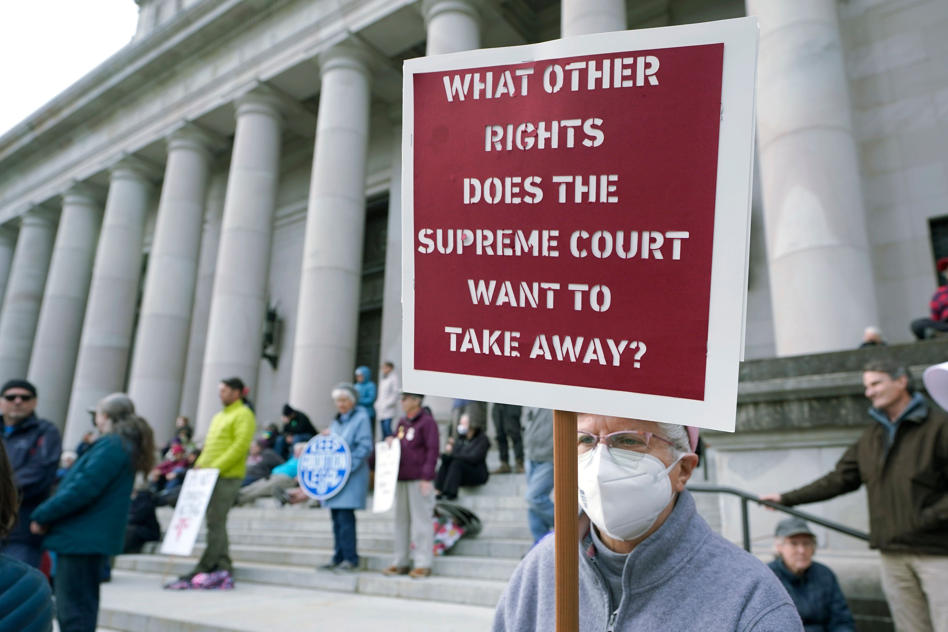 A person holds a sign referencing the U.S. Supreme Court as they take part in a rally in favor of abortion rights on the steps of the Temple of Justice, which houses the Washington state Supreme Court, Tuesday, May 3, 2022, at the Capitol in Olympia, Wash. (AP Photo/Ted S. Warren)