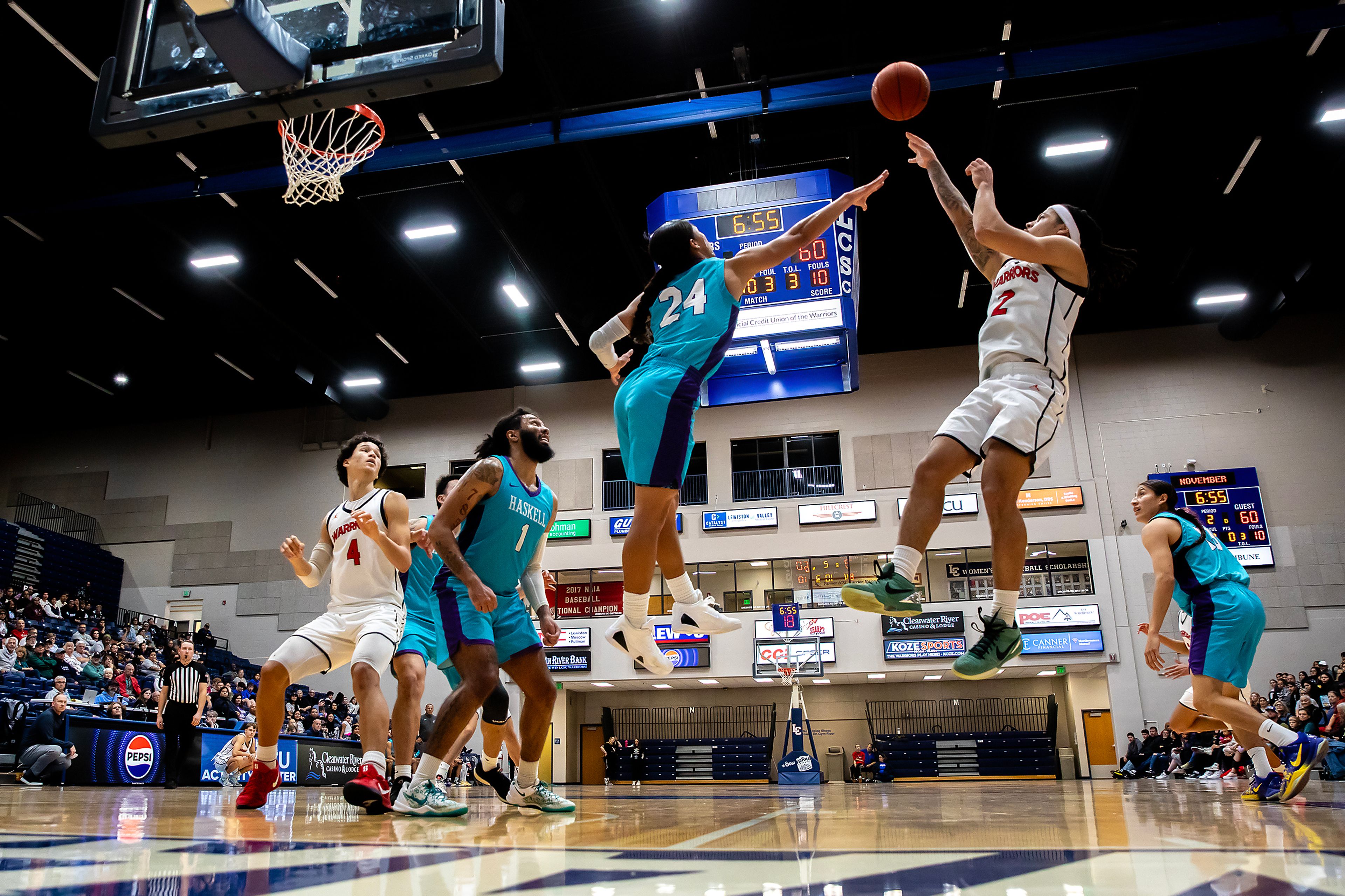 Lewis-Clark State guard MaCarhy Morris shoots the ball over Haskell�s Preson Olney during the season opening game as part of Tribal Nations Weekend Saturday in Lewiston.,