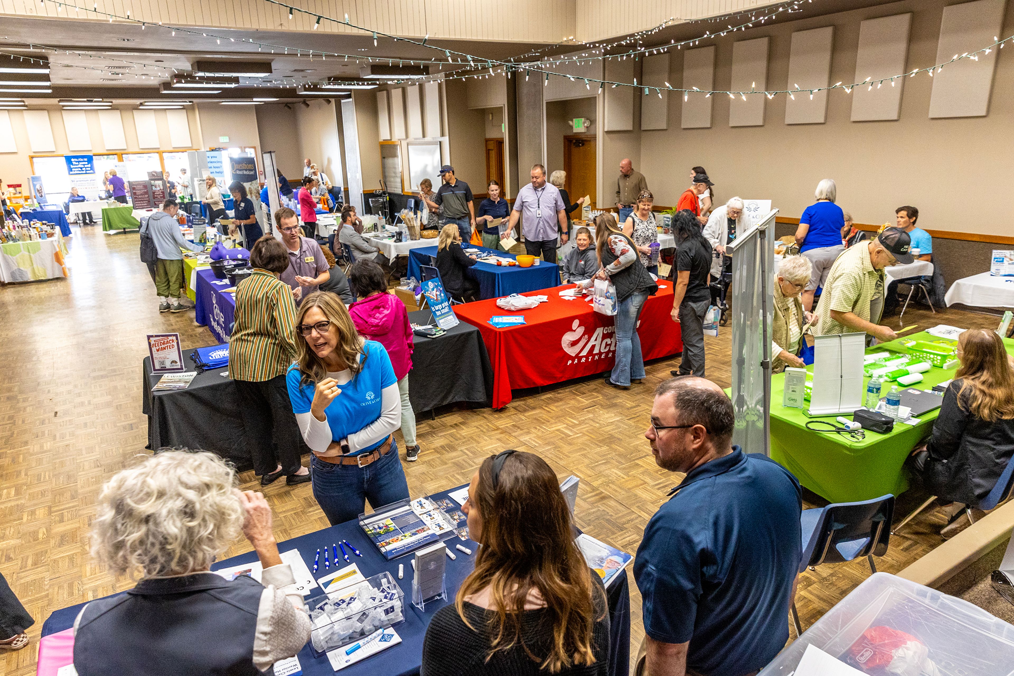 Vendors stand with their booths at a 2024 Annual Health and Wellness Fair on Thursday at the Lewiston Community Center. The event featured 48 vendors providing information, services and products available in the region.