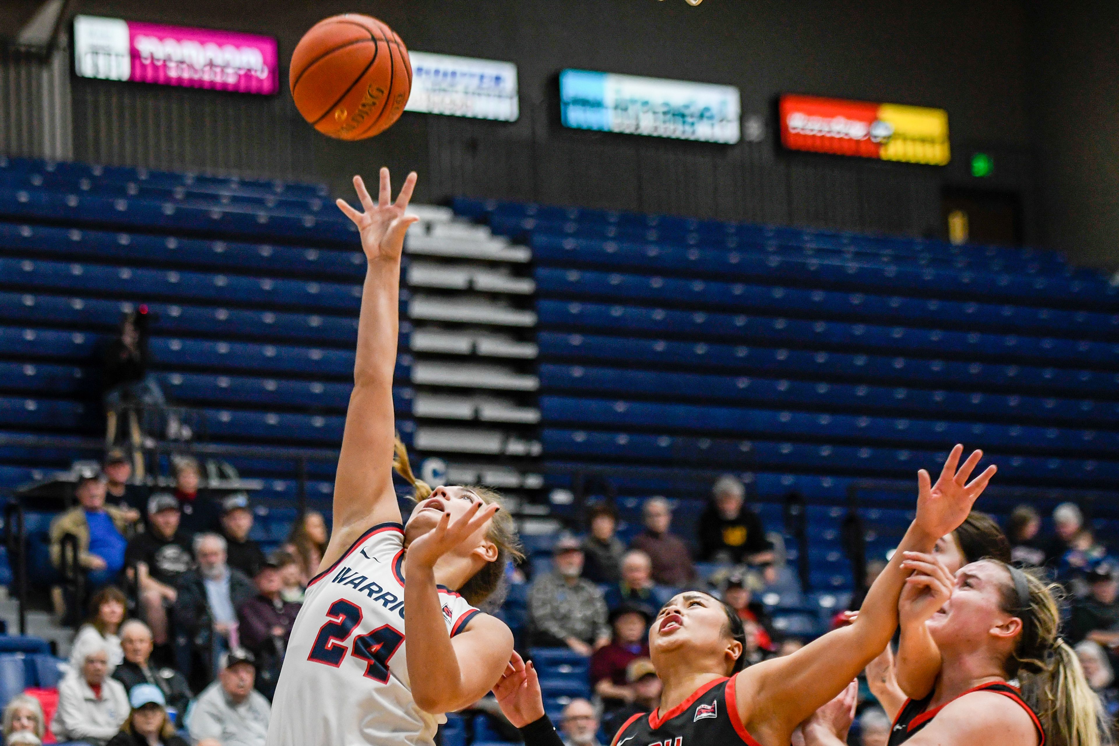 Lewis-Clark State guard Payton Hymas, left, shoots during Saturday's Cascade Conference game against Southern Oregon at the P1FCU Activity Center.